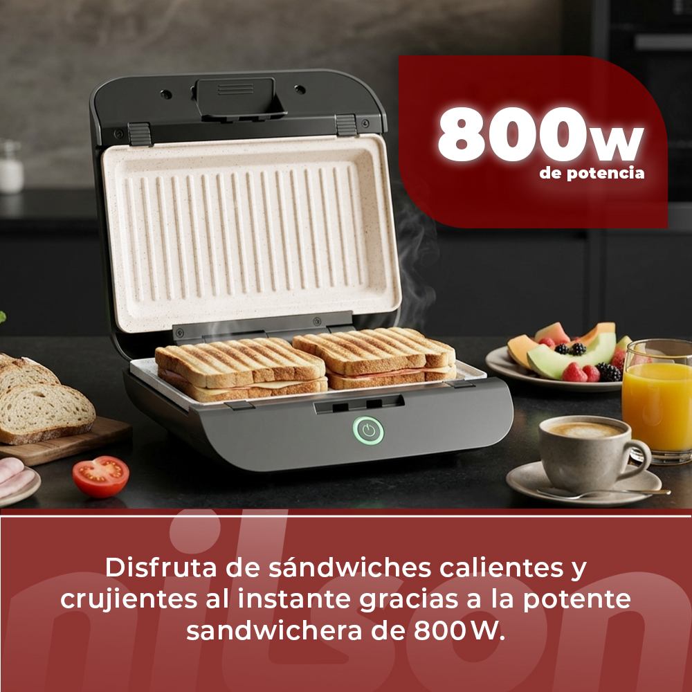 Un sandwichero de 800W tuesta sándwiches, junto a fruta y café.