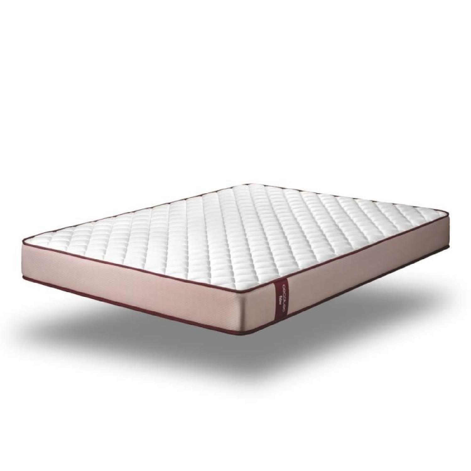 Een gewatteerde witte matras met een roze zijkant en donkere bies. Zwevend.