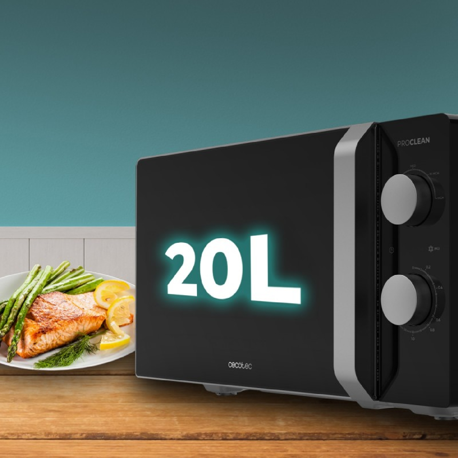 Microonde nero con display 20L accanto a un piatto di salmone con asparagi.