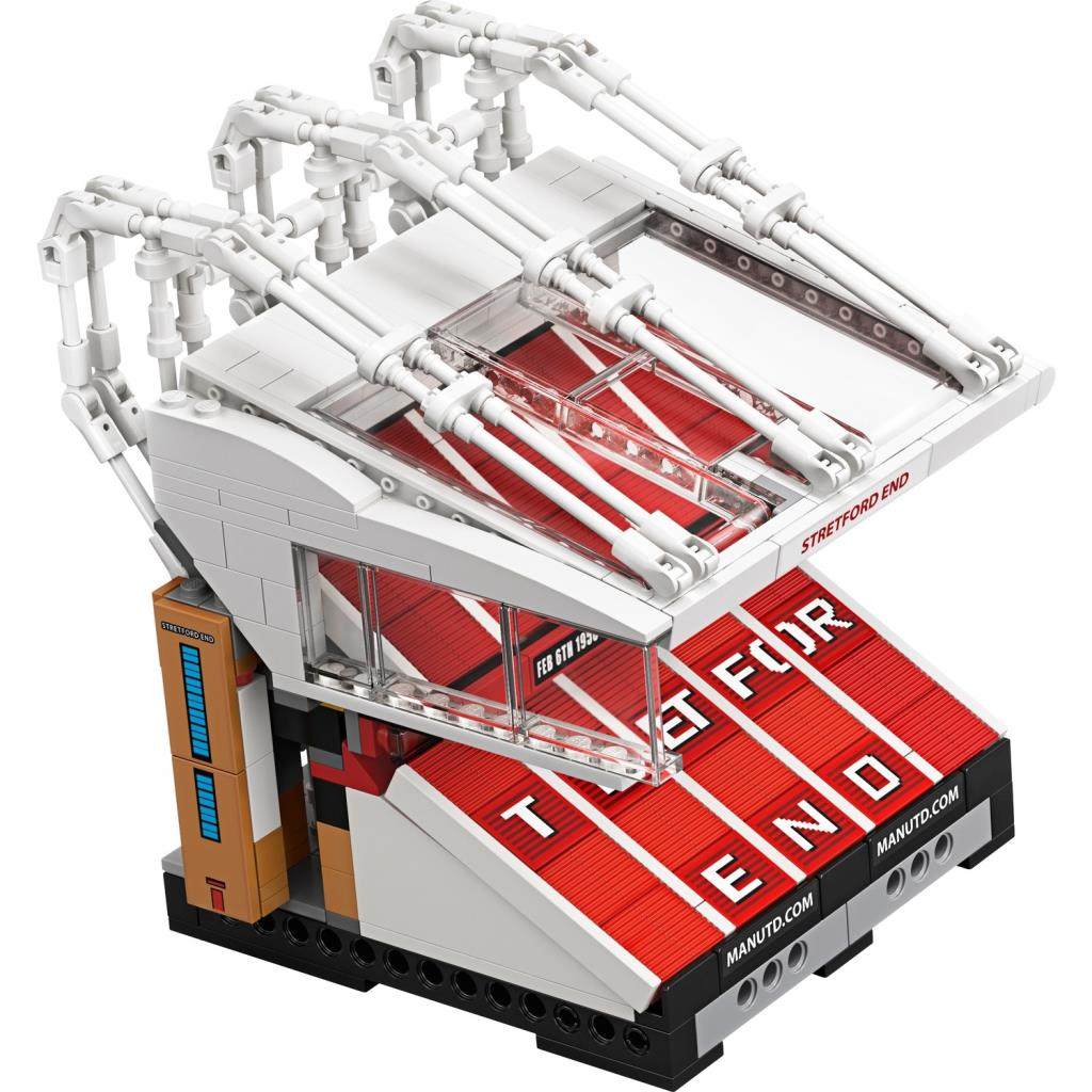 Tribünleri, yazısı ve çatı yapısı olan bir futbol stadyumunun Lego modeli.