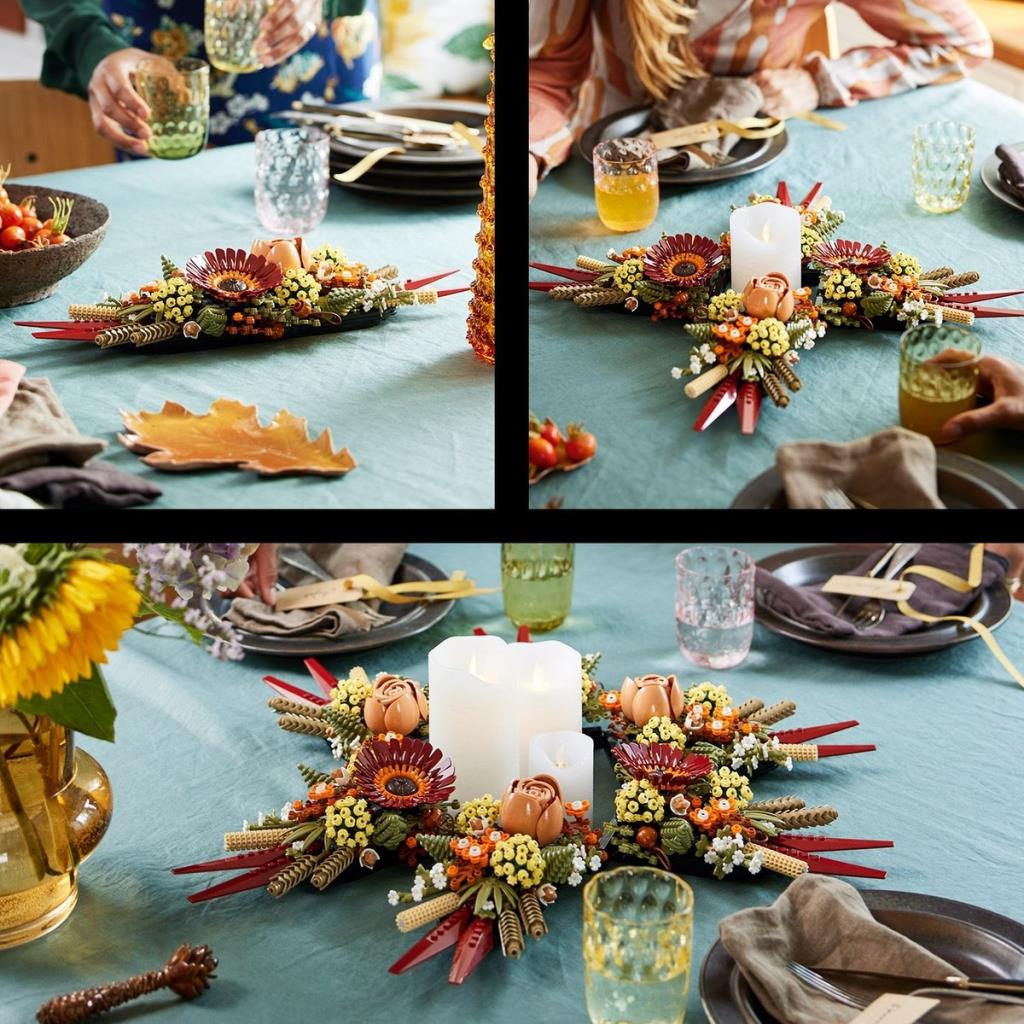 Décoration de table d'automne avec bougies, fleurs et baies sur une nappe bleue.