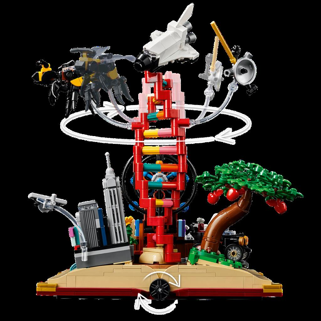 Lego modeli uzay mekiği, arı, ağaç ve şehir öğeleriyle DNA kulesini gösteriyor.