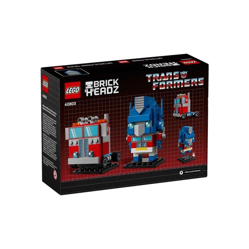Optimus Prime kamyon ve kafa modelleri içeren Lego BrickHeadz kutusu.