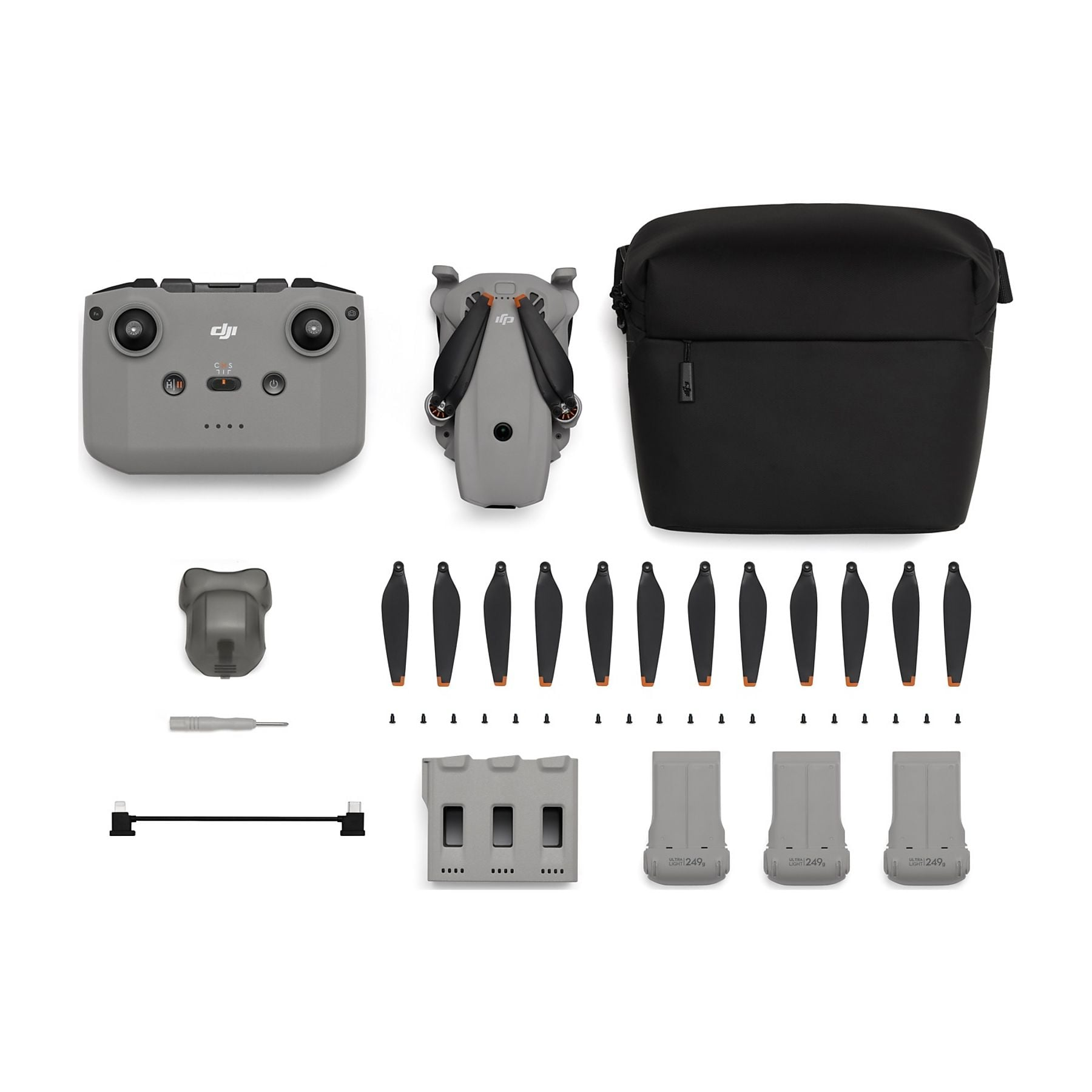 Drone con accessori: telecomando, borsa, ricambi e batterie.