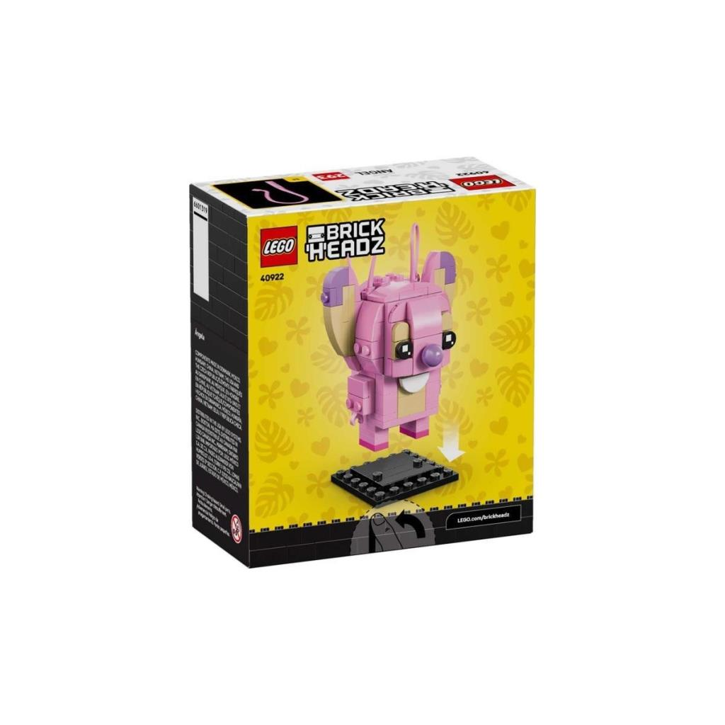 Çiçekli sarı arka plan üzerinde pembe LEGO BrickHeadz karakterli kutu.