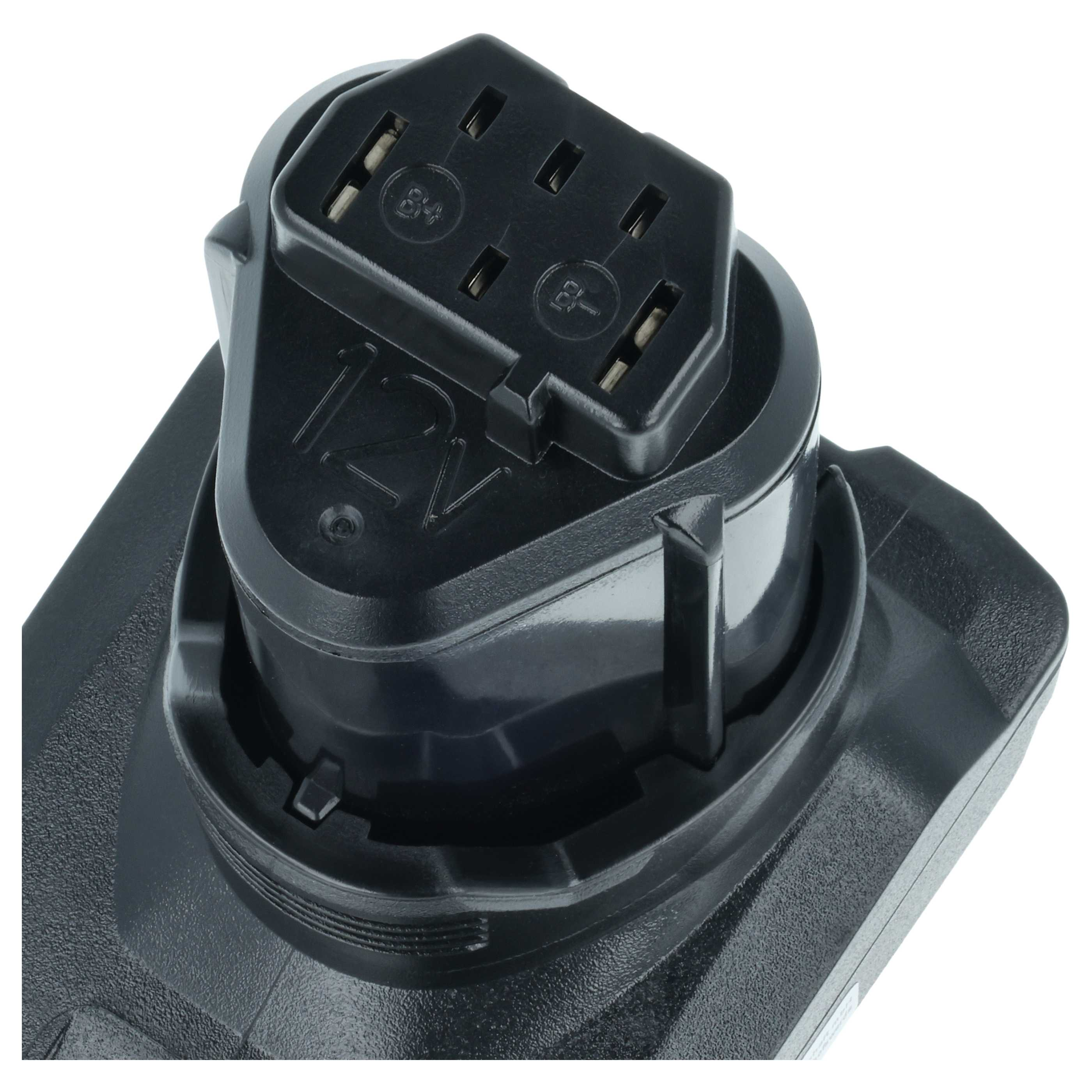 Nahaufnahme eines schwarzen Batterieadapters mit Anschlüssen und der Aufschrift "12V".