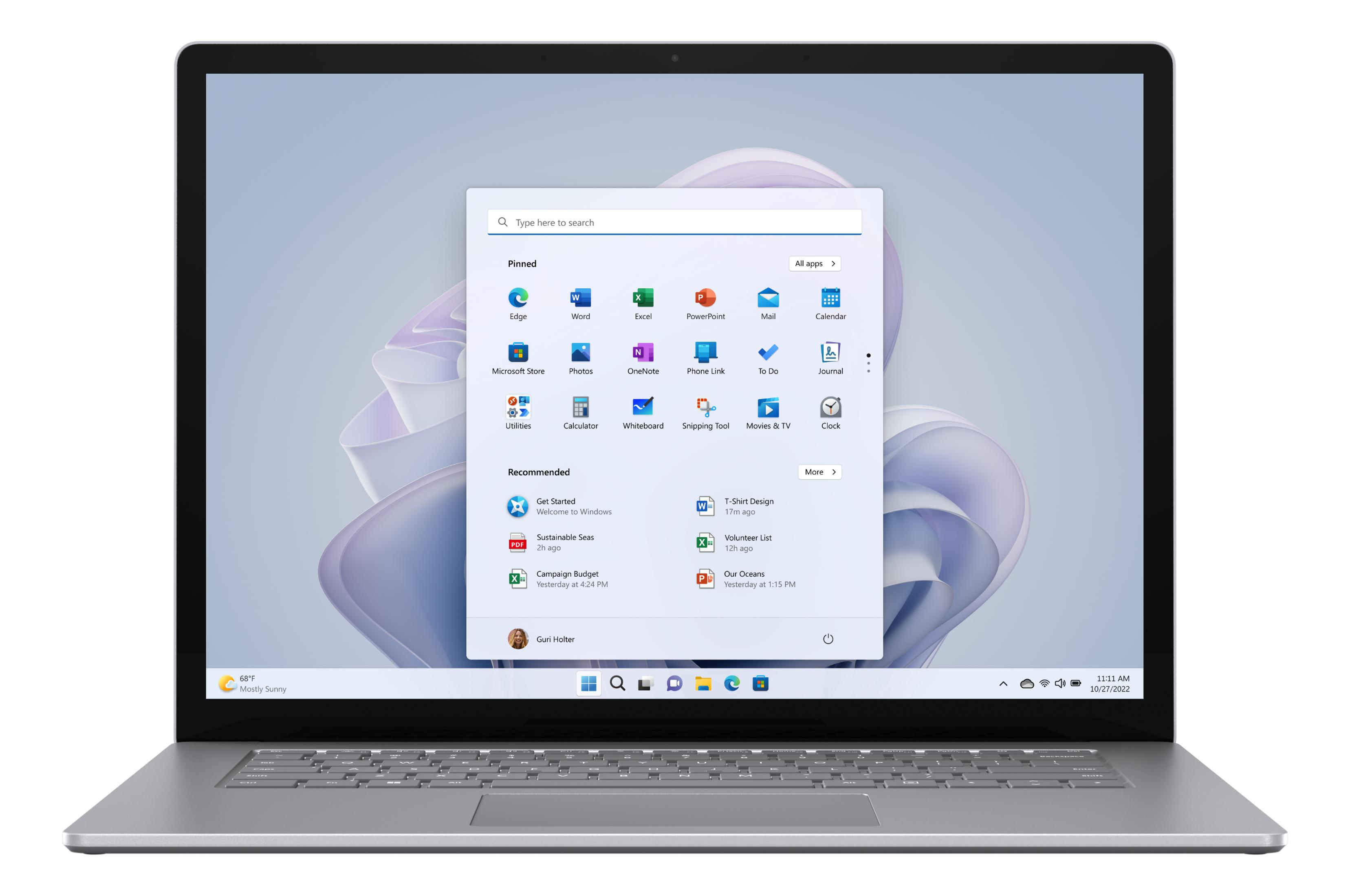 Ein silberner Laptop zeigt den Windows 11 Startbildschirm mit angepinnten und empfohlenen Apps.