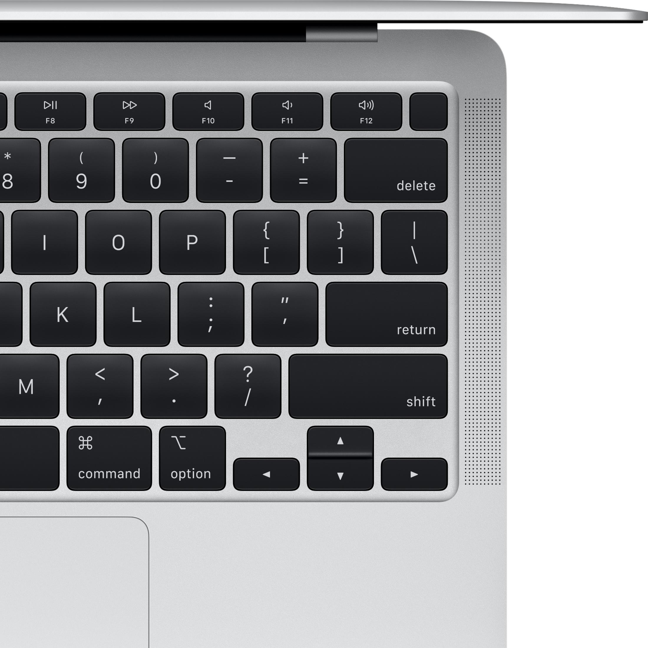 Gros plan d'un clavier d'ordinateur portable argenté avec touches noires.