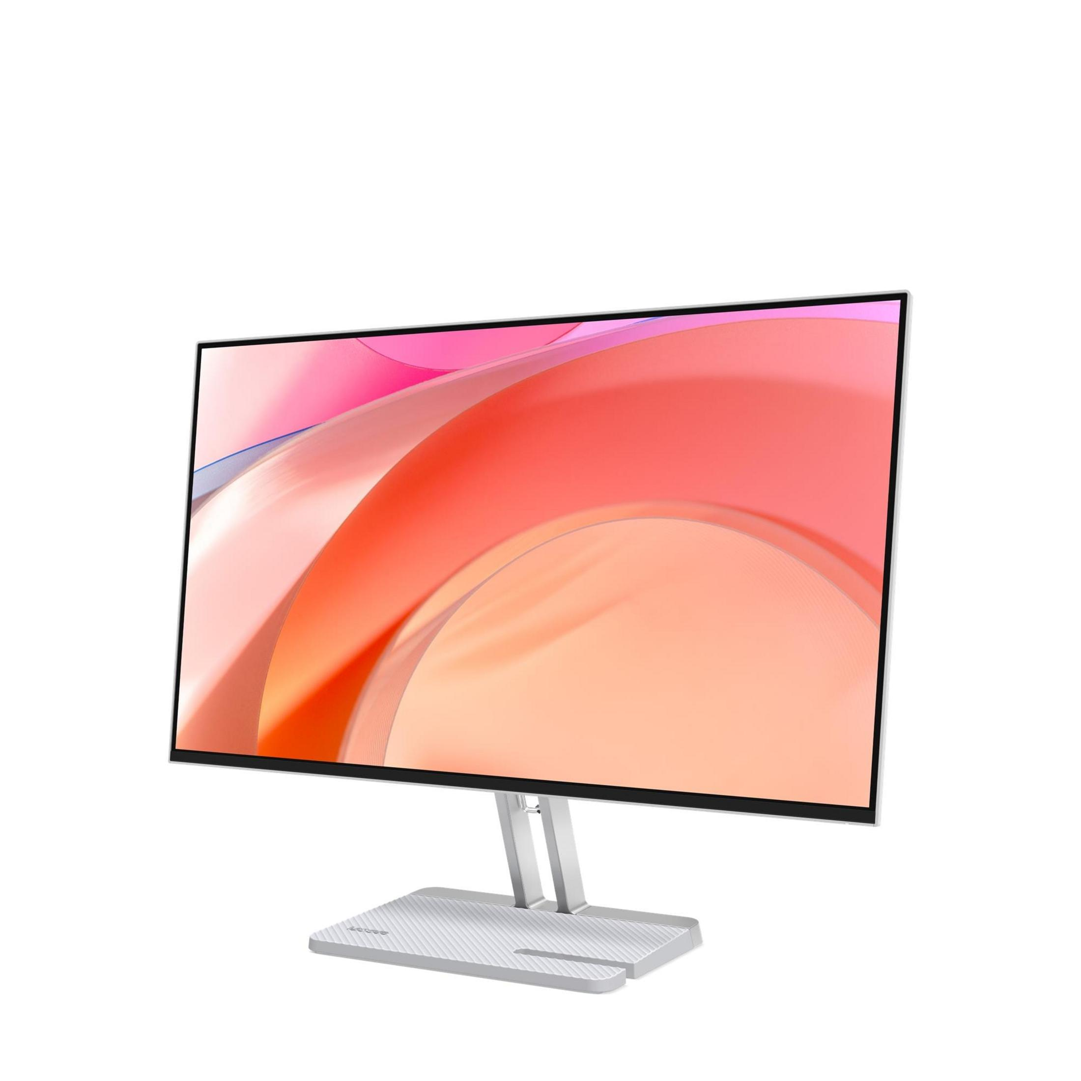 Een moderne zilveren computermonitor met een abstracte koraalkleurige achtergrond.