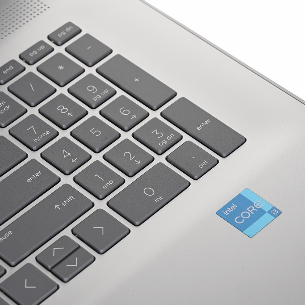 Szara klawiatura laptopa z naklejką Intel Core i3.