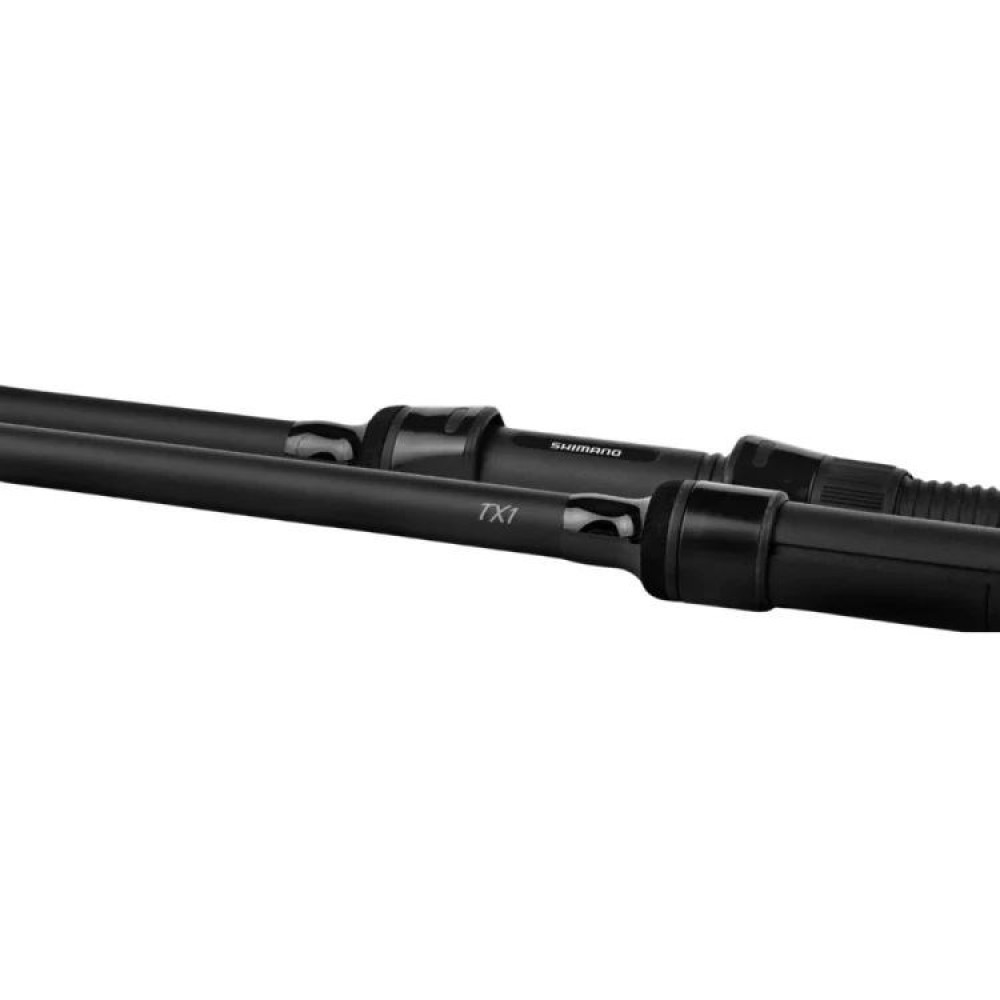 Dwa czarne wędki z napisem Shimano TX1, zbliżenie.