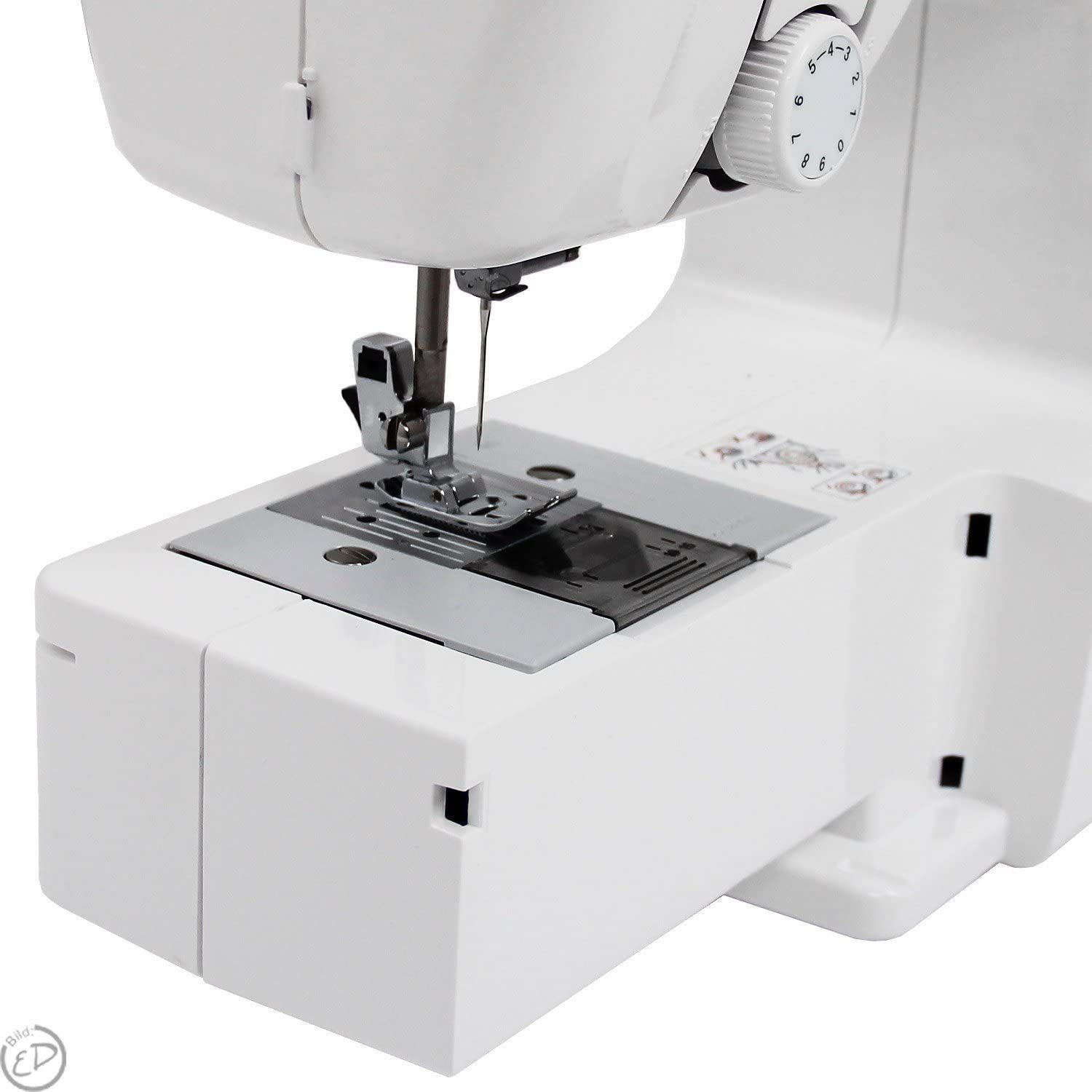 Close-up of a white sewing machine, showing the needle and presser foot.