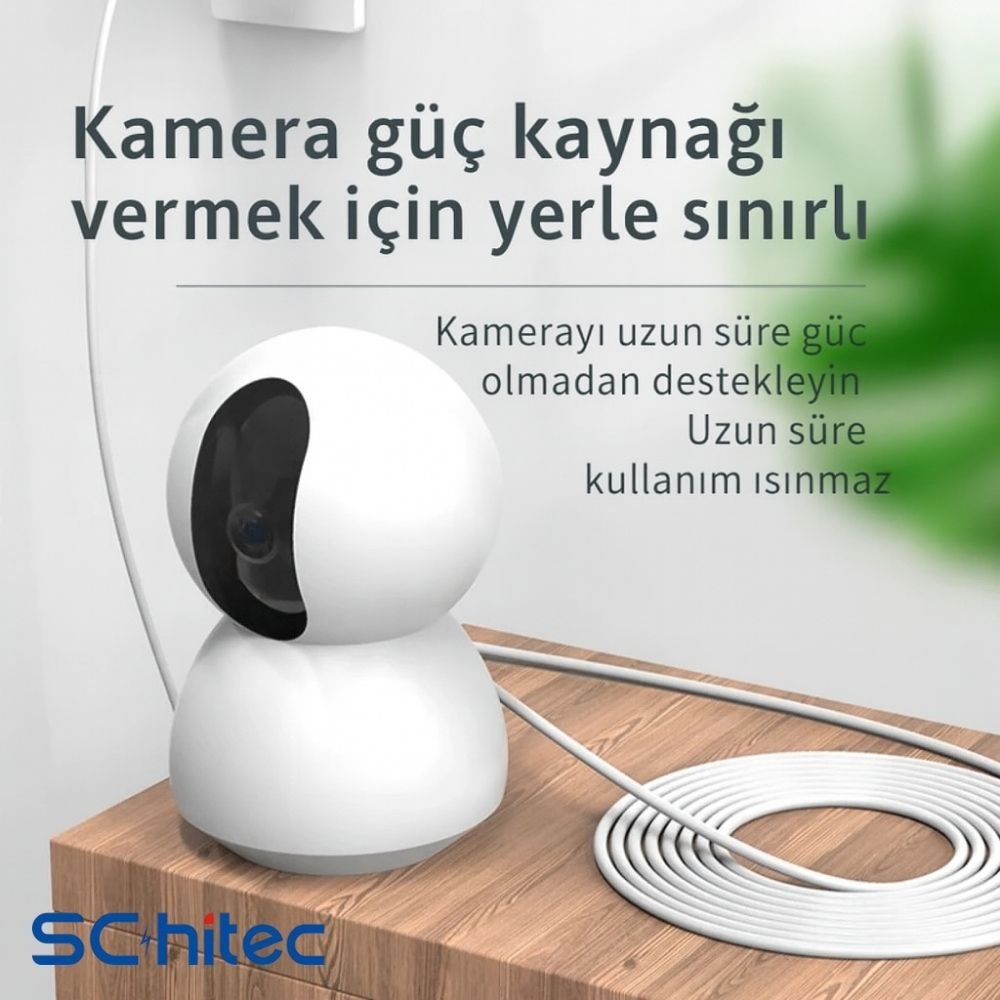 Ahşap yüzeyde beyaz güvenlik kamerası, etrafına sarılmış beyaz kablo.