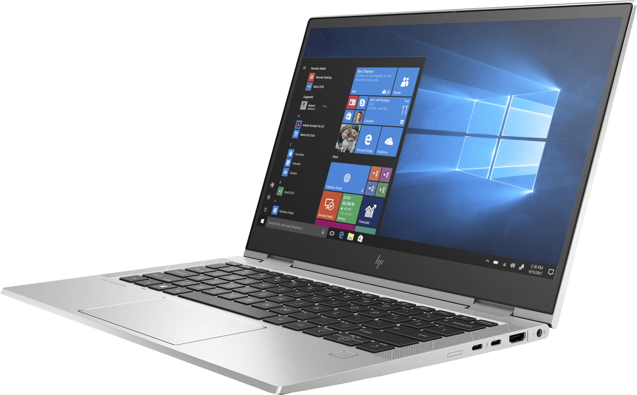 Un portátil plateado con la pantalla abierta, mostrando el sistema operativo Windows.