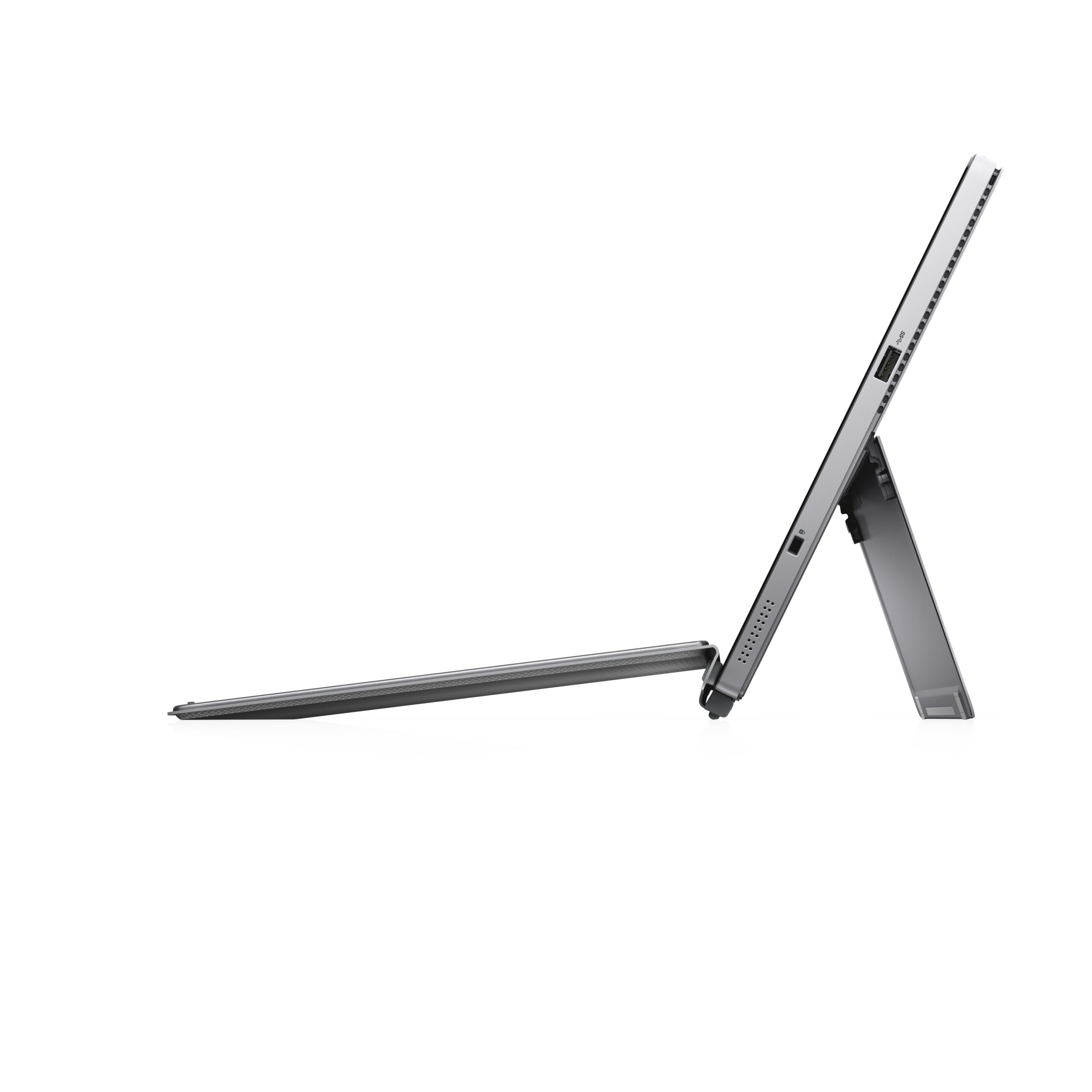 Una tableta gris con su soporte y teclado, vista de lado.
