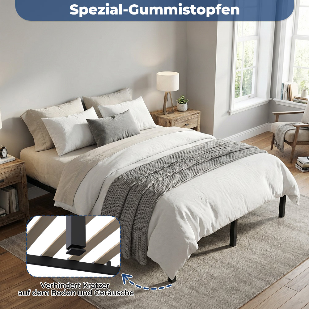 Ein Bett mit weißen und grauen Kissen, Decken und einem Nachttisch.