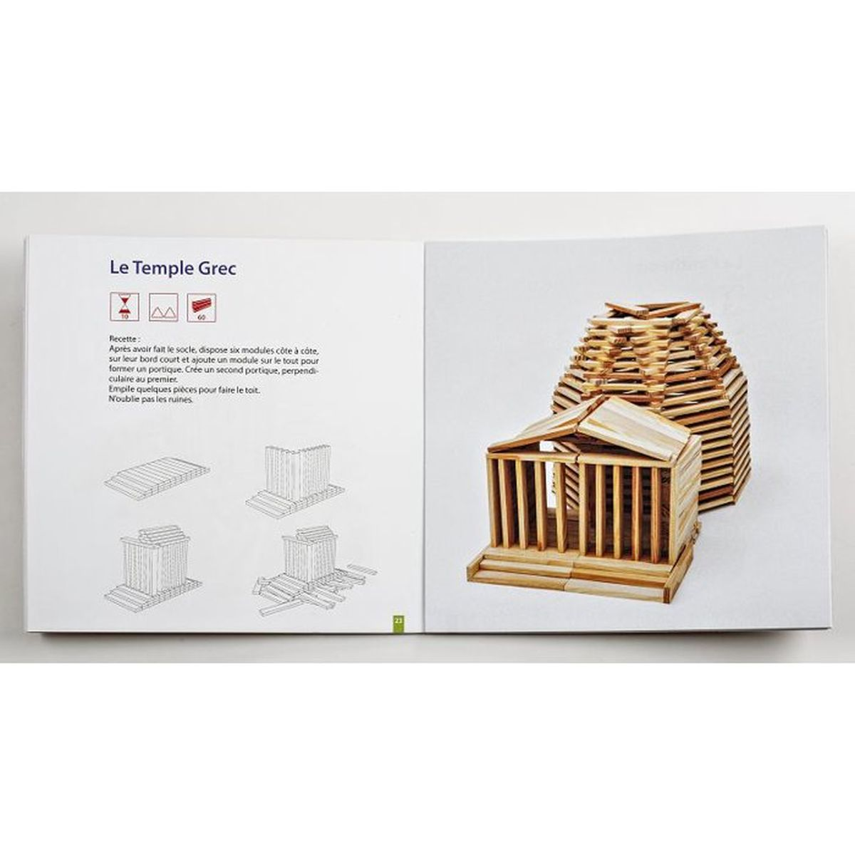 Un libro che mostra le istruzioni per costruire un tempio greco con bastoncini di legno.