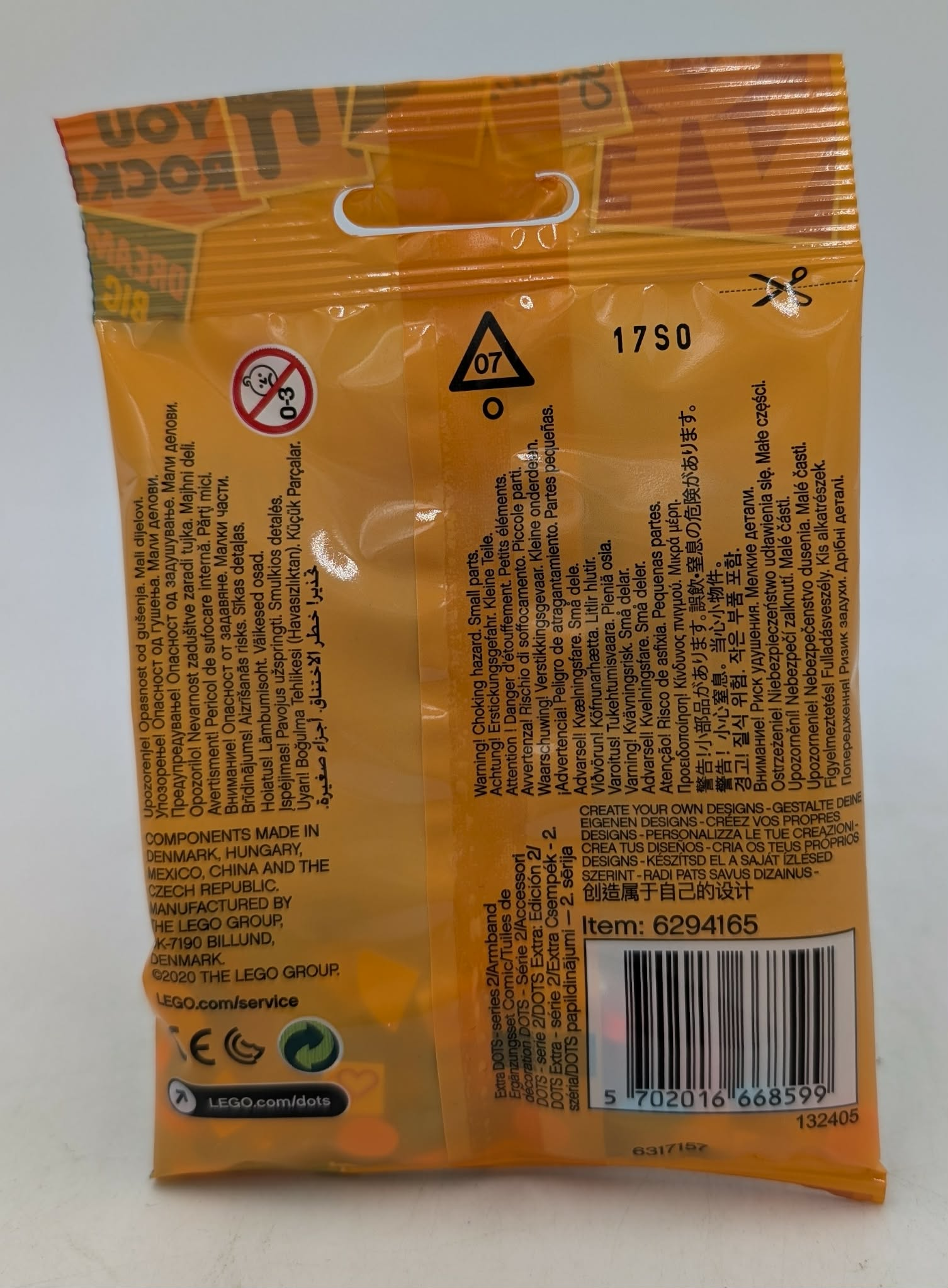 Gelbe LEGO DOTS-Tüte mit Warnhinweisen, Altersangabe 0-3 und Barcode.