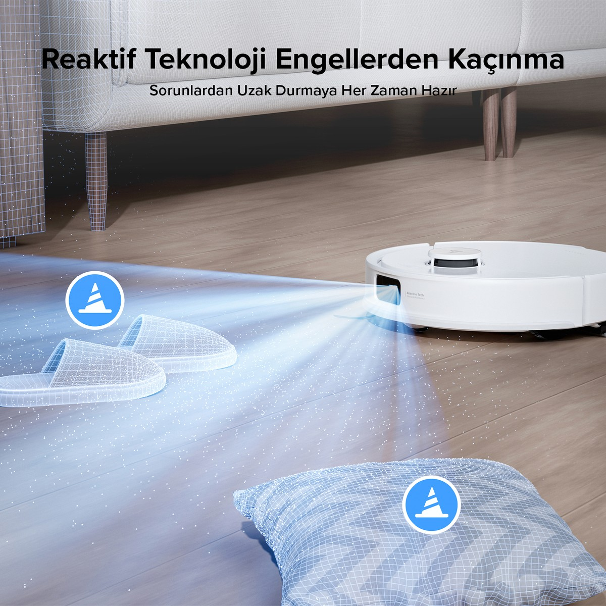 Beyaz robot süpürge, terlikleri ve yastığı algılayarak zemini tarıyor.