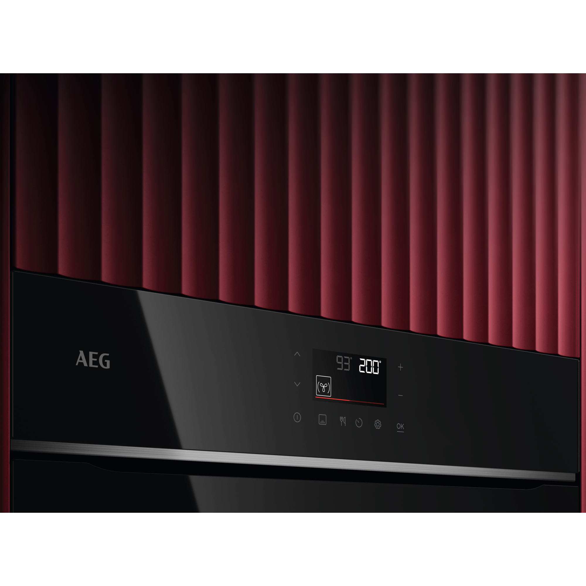 Elettrodomestico AEG nero con sfondo a coste rosse e display digitale.