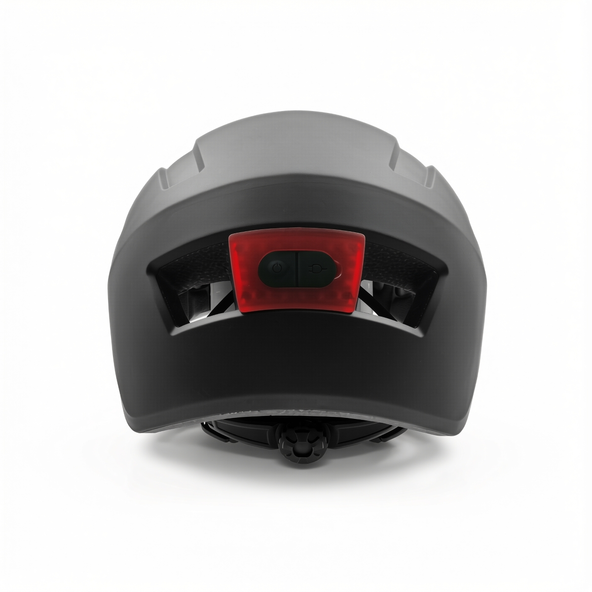 Vista trasera de un casco de bicicleta negro con luz roja integrada y dial de ajuste.