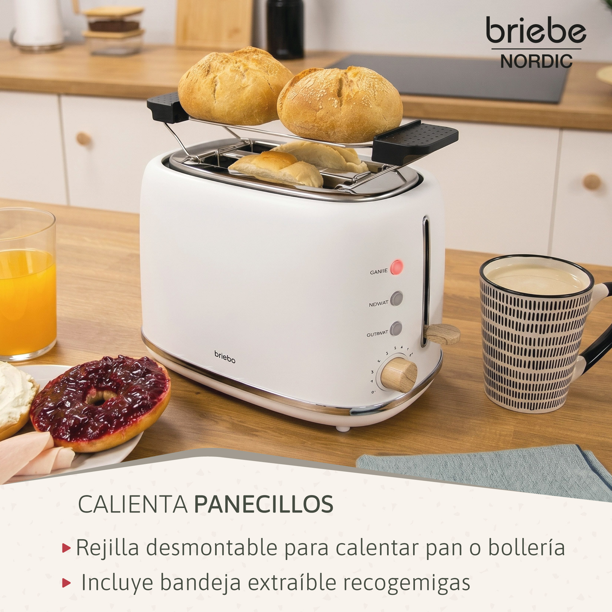 Una tostadora blanca con bollos y una taza de café sobre una mesa.