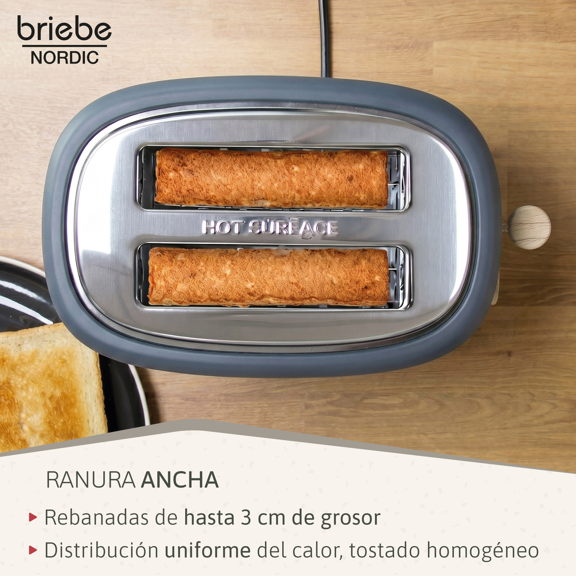 Un tostador gris con dos rebanadas de pan perfectamente tostadas saliendo de las ranuras.