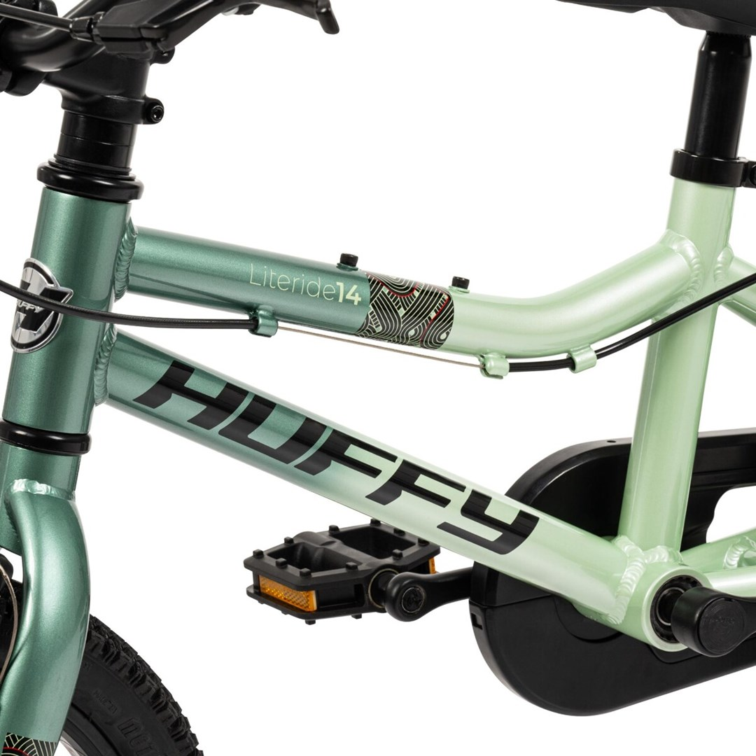 Jasnozielony rower dziecięcy z logo "HUFFY" i napisem "Literide14".