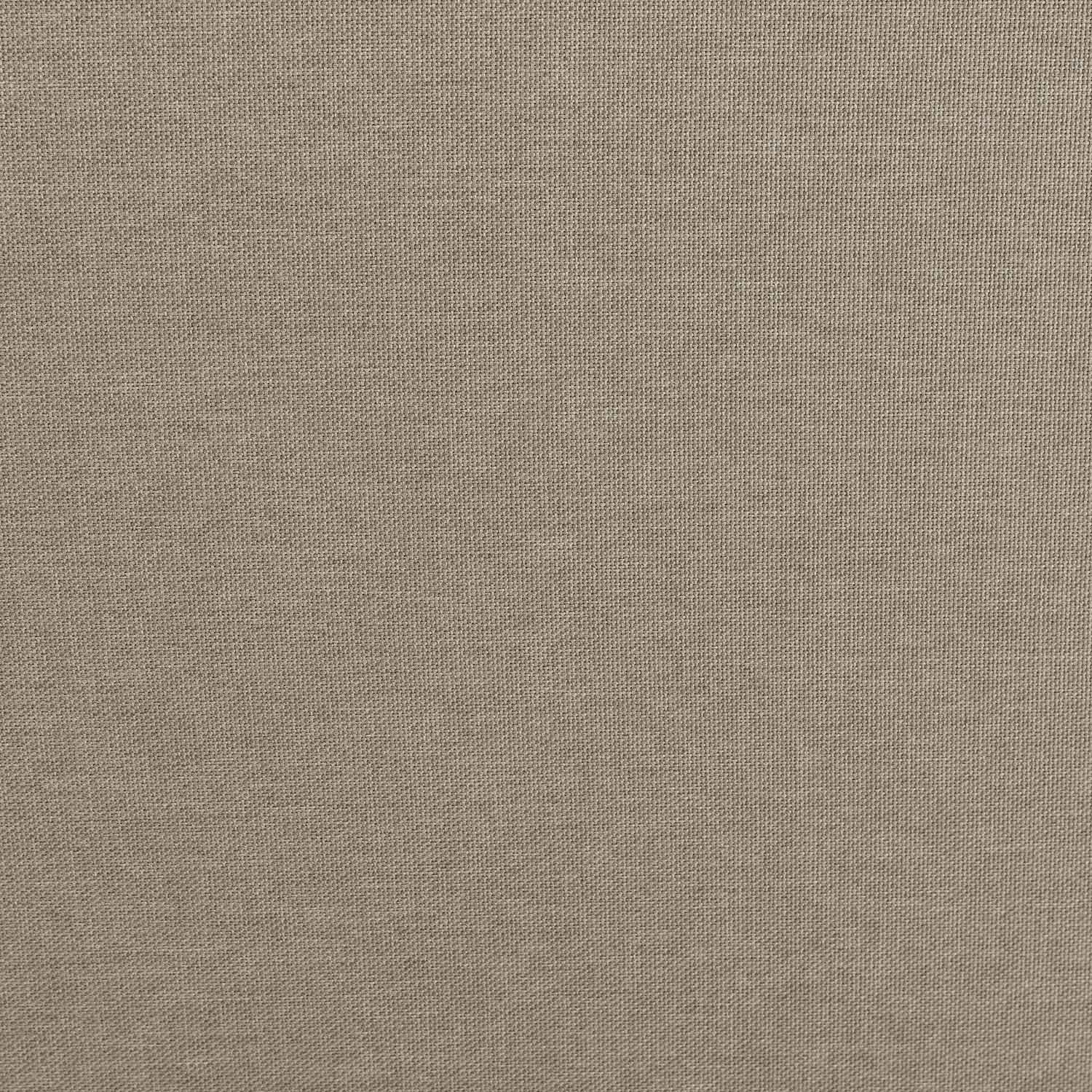 Un primer plano de tela beige que muestra su textura tejida visible.