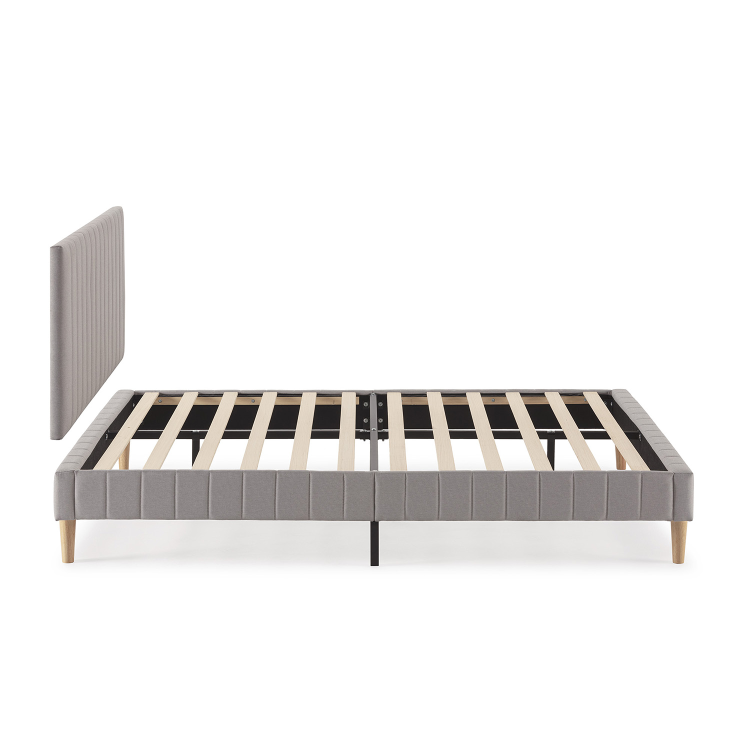 Estructura de cama tapizada gris con somier y cabecero separado.