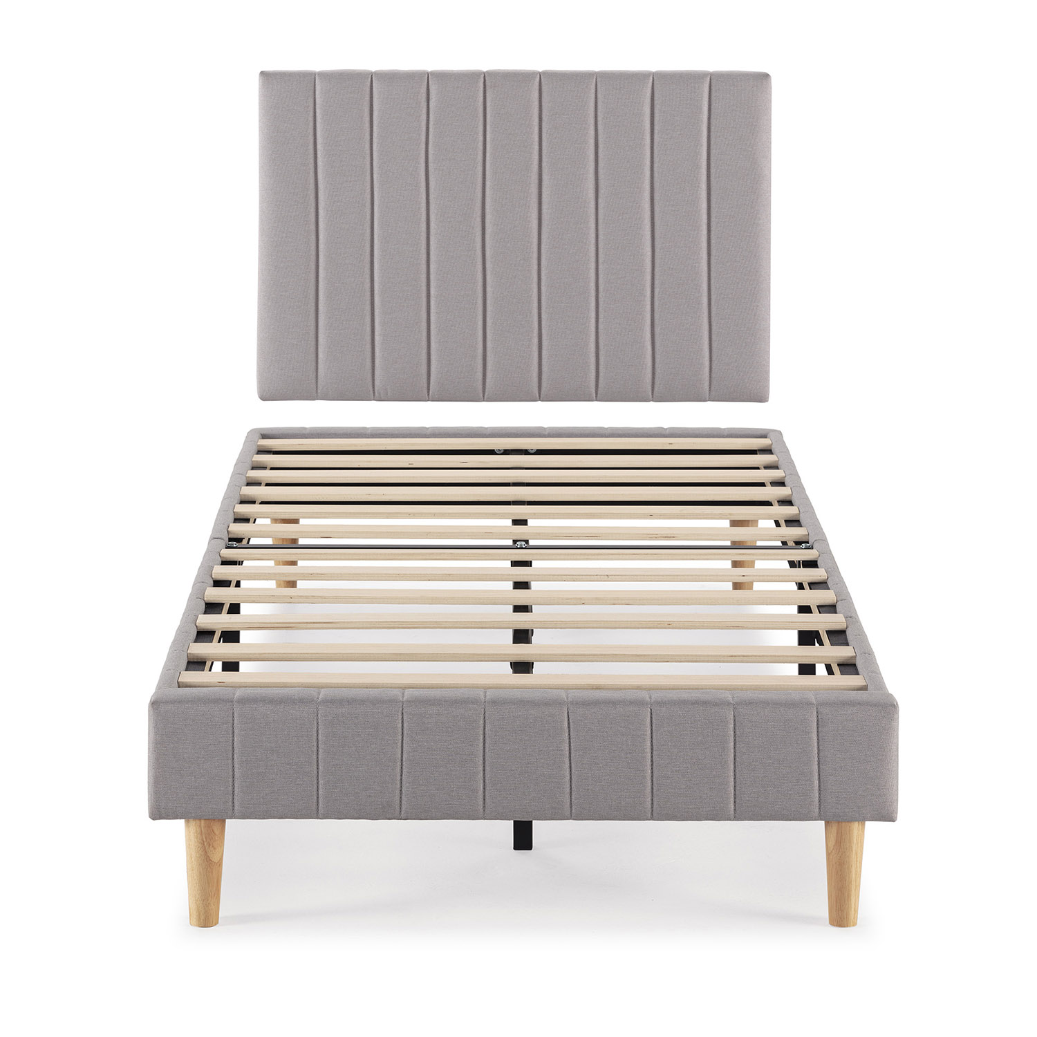 Un somier tapizado gris con base de listones y patas de madera.