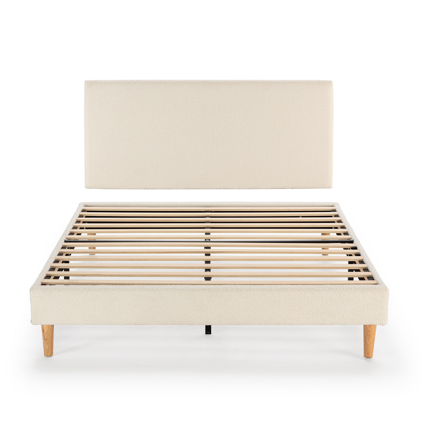 Un somier de color crema con base de listones y cabecero rectangular.