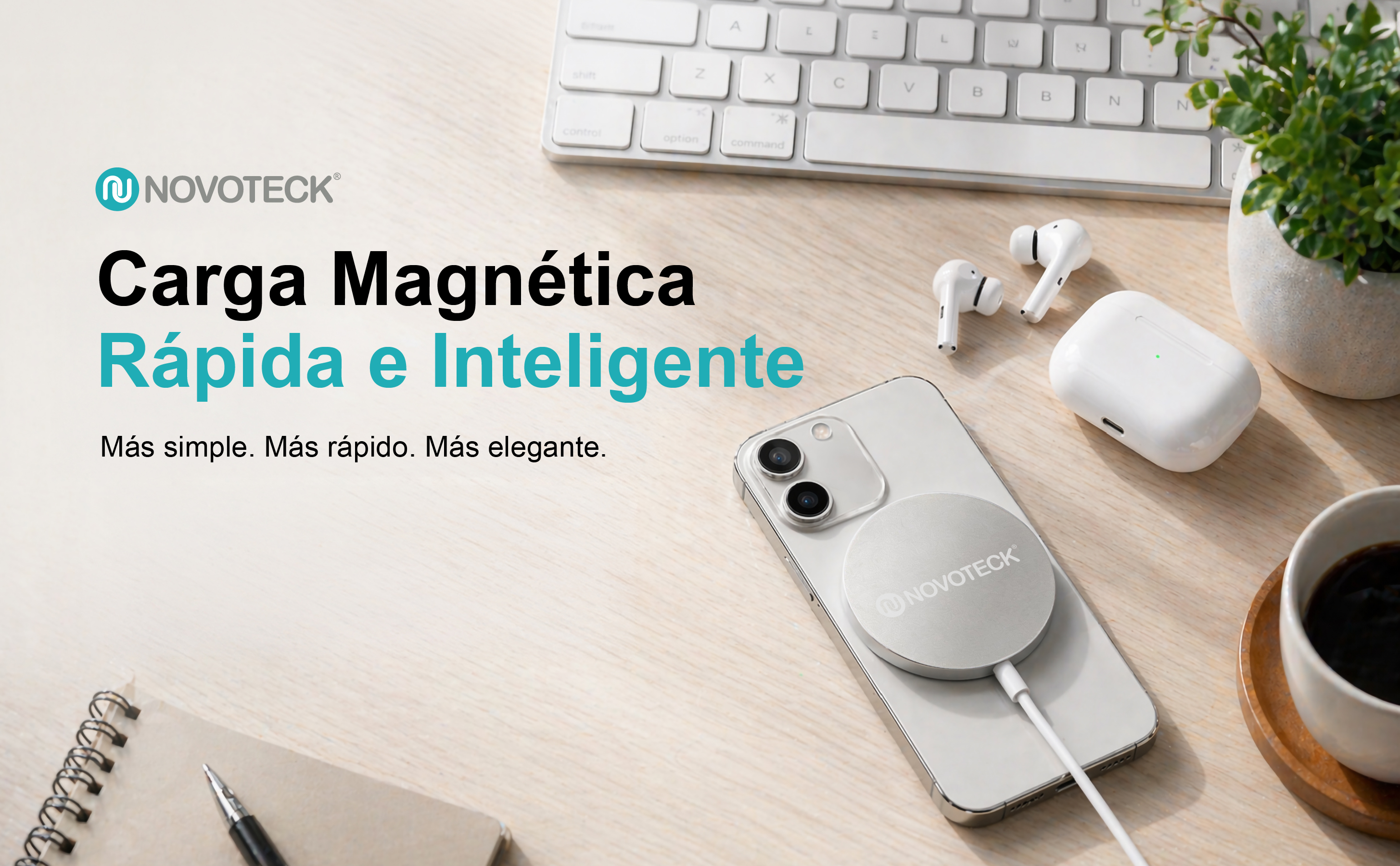 Un smartphone se carga magnéticamente, con auriculares y teclado cerca.