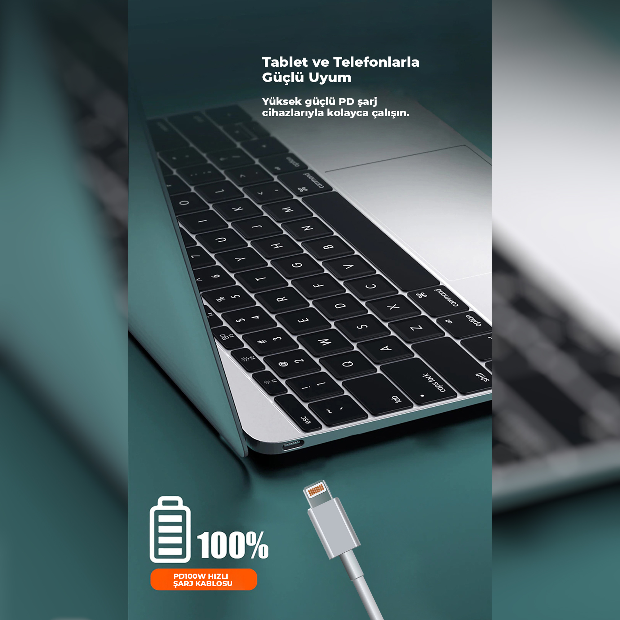 Şarj kablosu ve %100 pil simgesiyle laptop klavyesinin yakın çekimi.