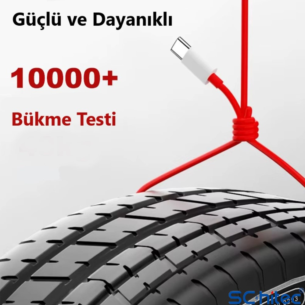 USB-C konnektörlü kırmızı bir kablo bir lastik üzerinde düğümlenmiş. Metin: 10000+ Bükme testi.