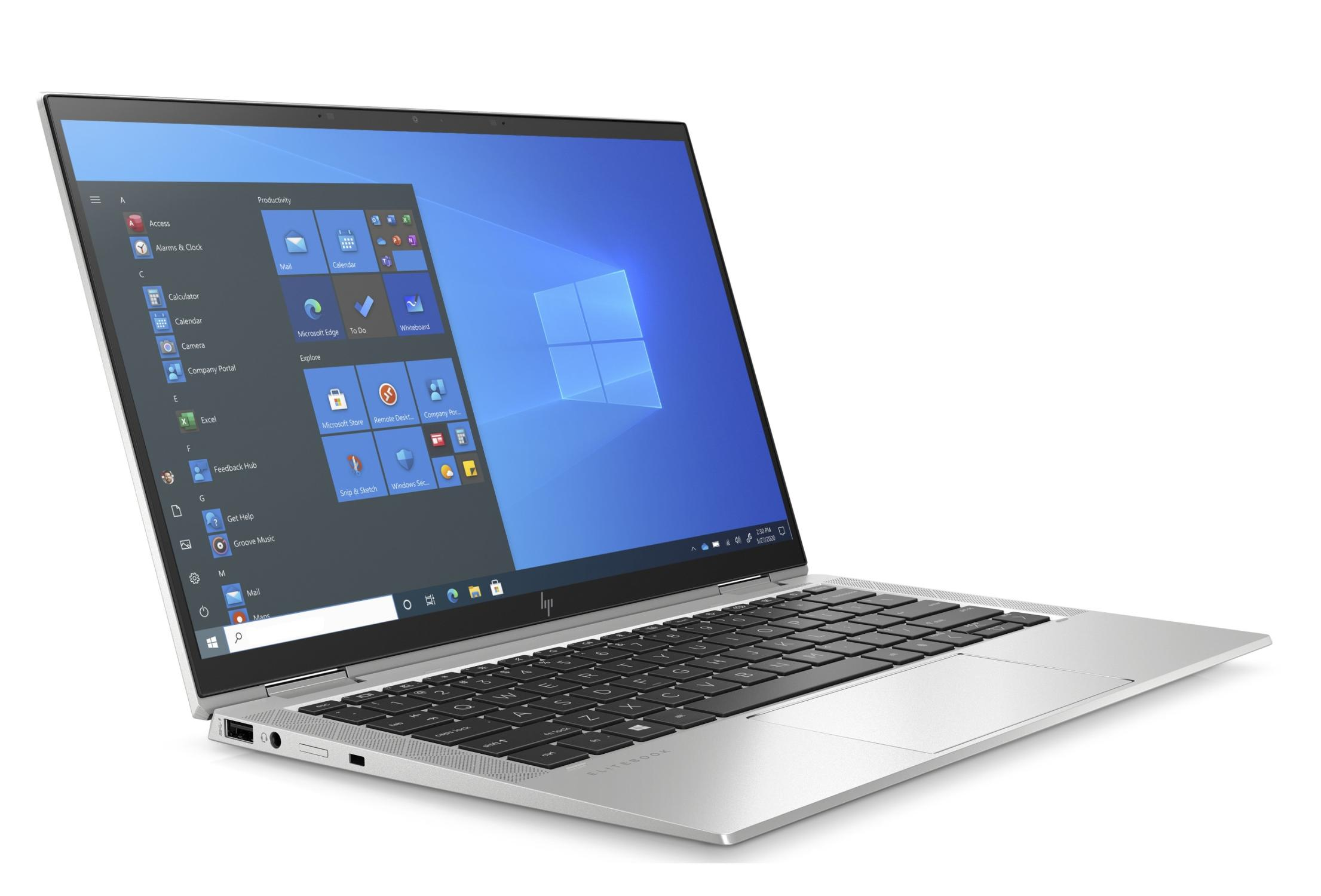 Ein geöffneter silberner Laptop mit einem Startmenü auf dem Bildschirm.
