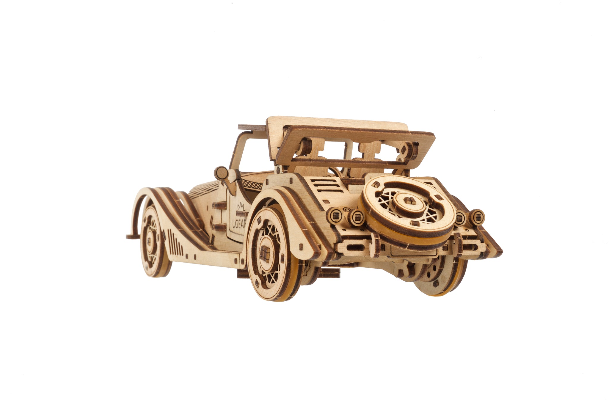 Modello in legno di un'auto d'epoca cabriolet con ruota di scorta posteriore e capote aperta.