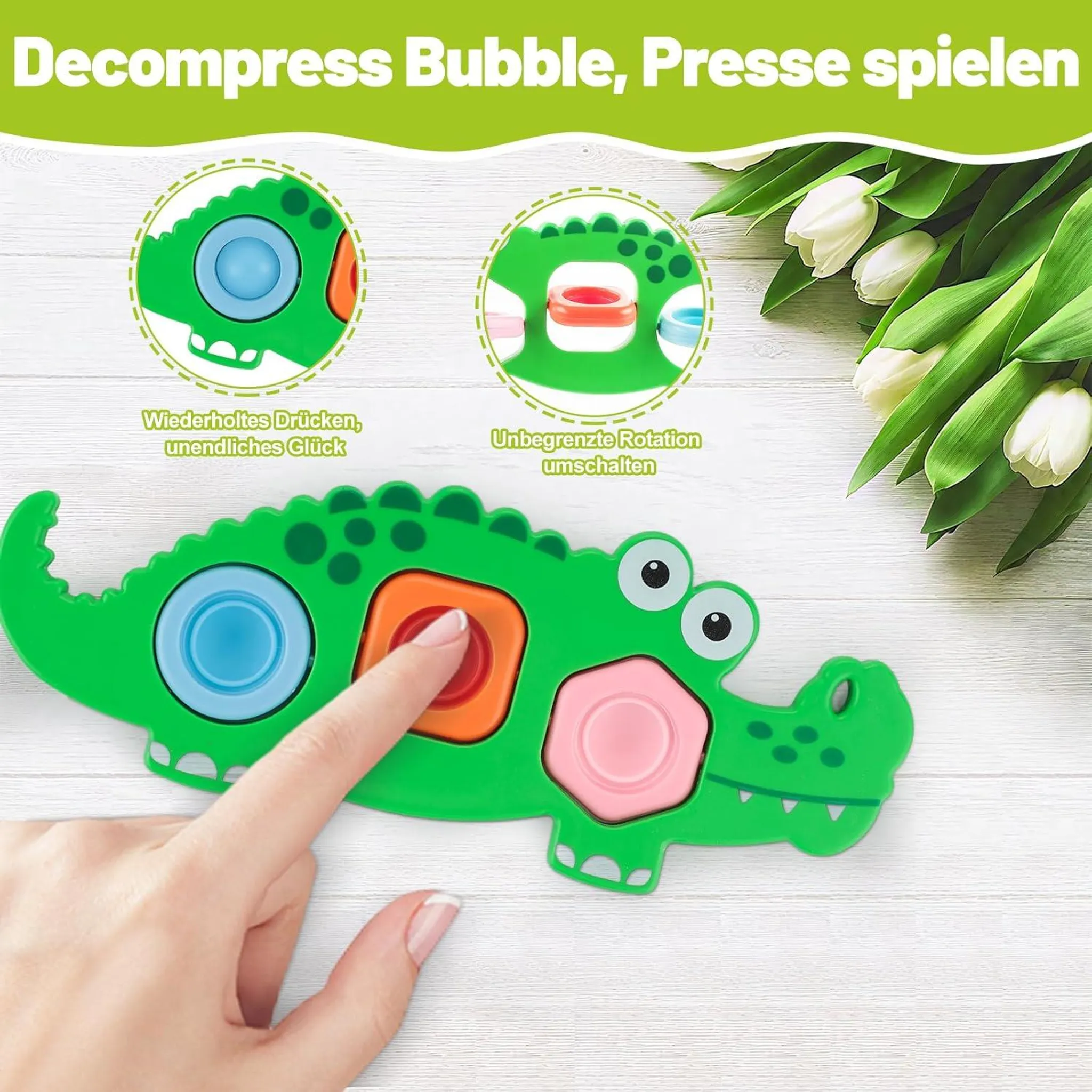 Grüner Krokodil-Fidget-Spielzeug mit bunten Knöpfen, das von einer Hand gedrückt wird.