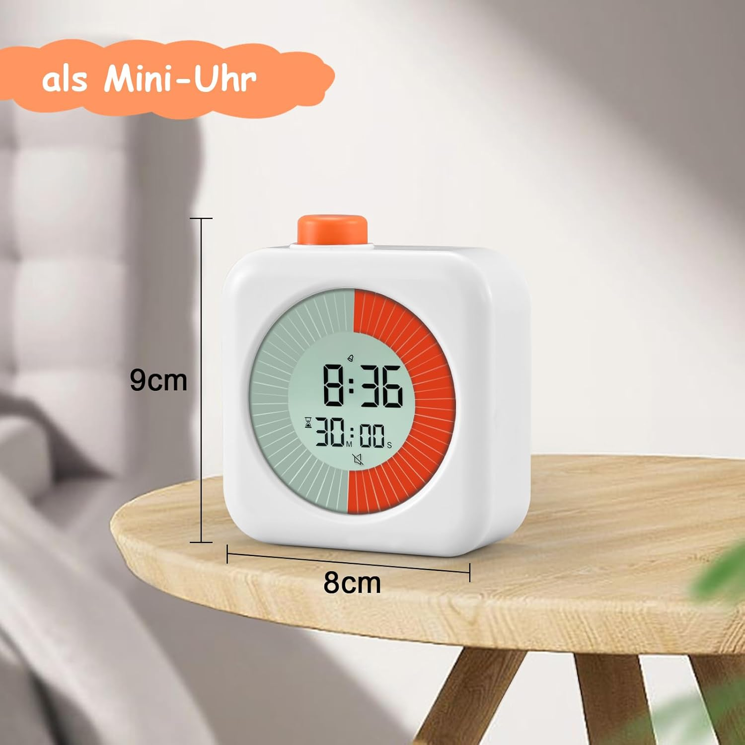 Ein weißer digitaler Timer mit orangefarbenem Knopf auf einem Holztisch.