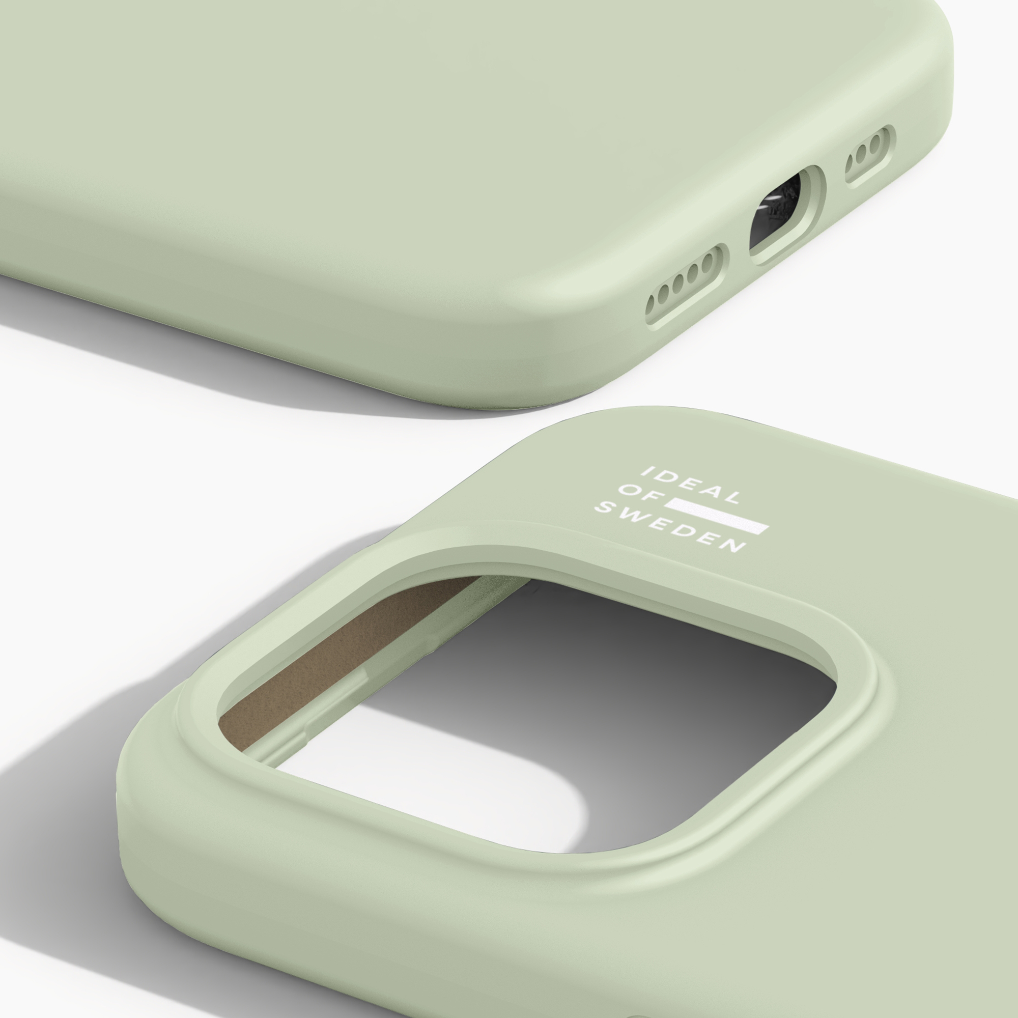 Helle grüne iPhone-Hülle zeigt Ausschnitte und Markenschriftzug.