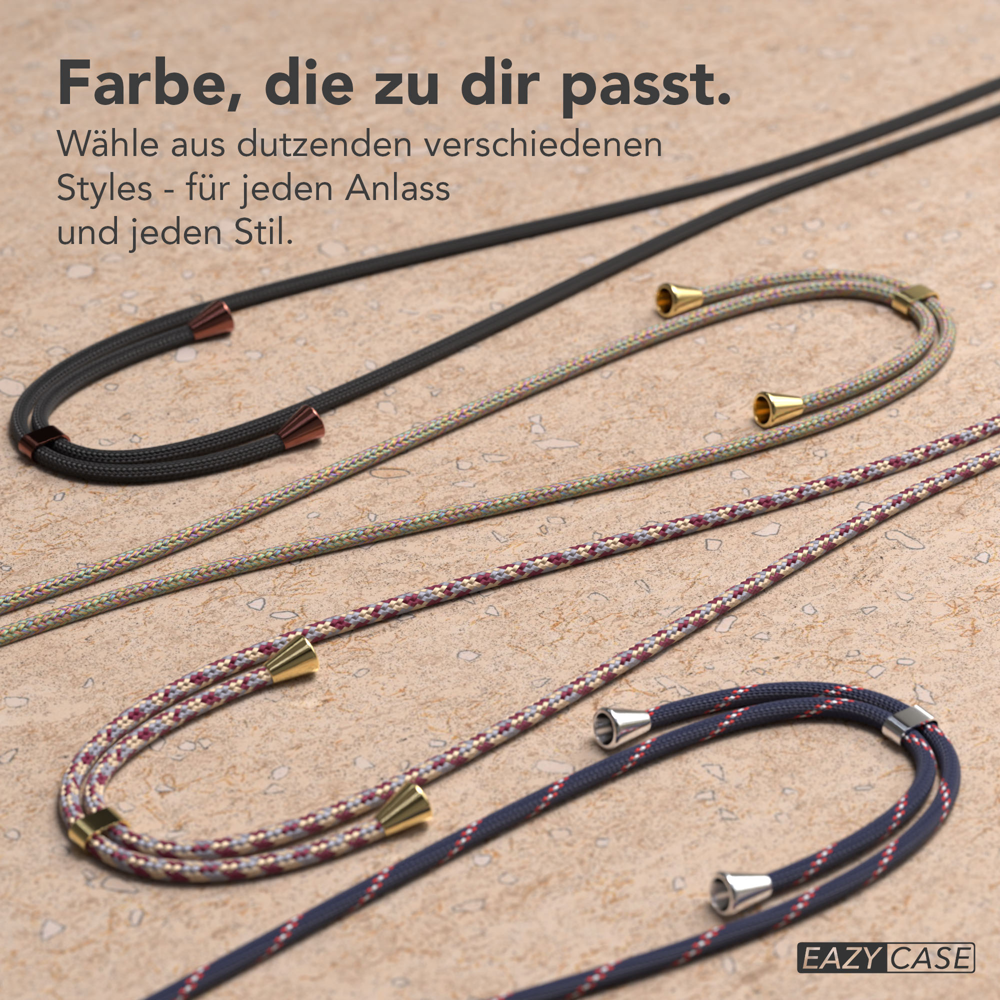 Vier farbige Kordeln mit Metallenden auf hellem Untergrund.
