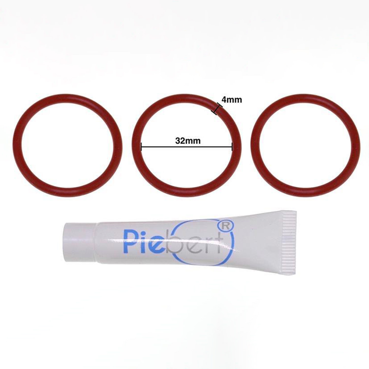 Drei rote O-Ringe und eine kleine Tube weiße Paste mit blauem Logo.