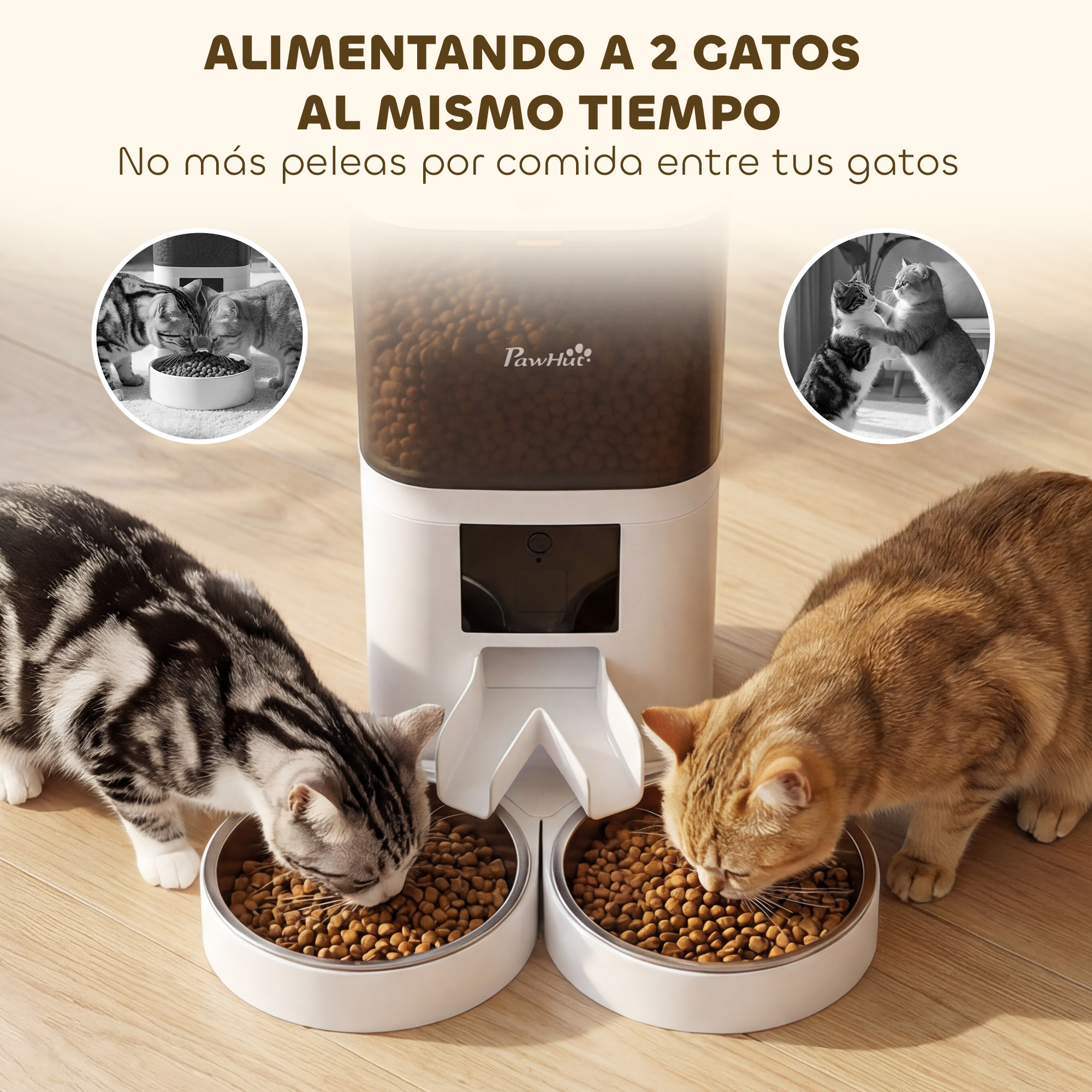 Dos gatos comen de un dispensador blanco en un suelo de madera.