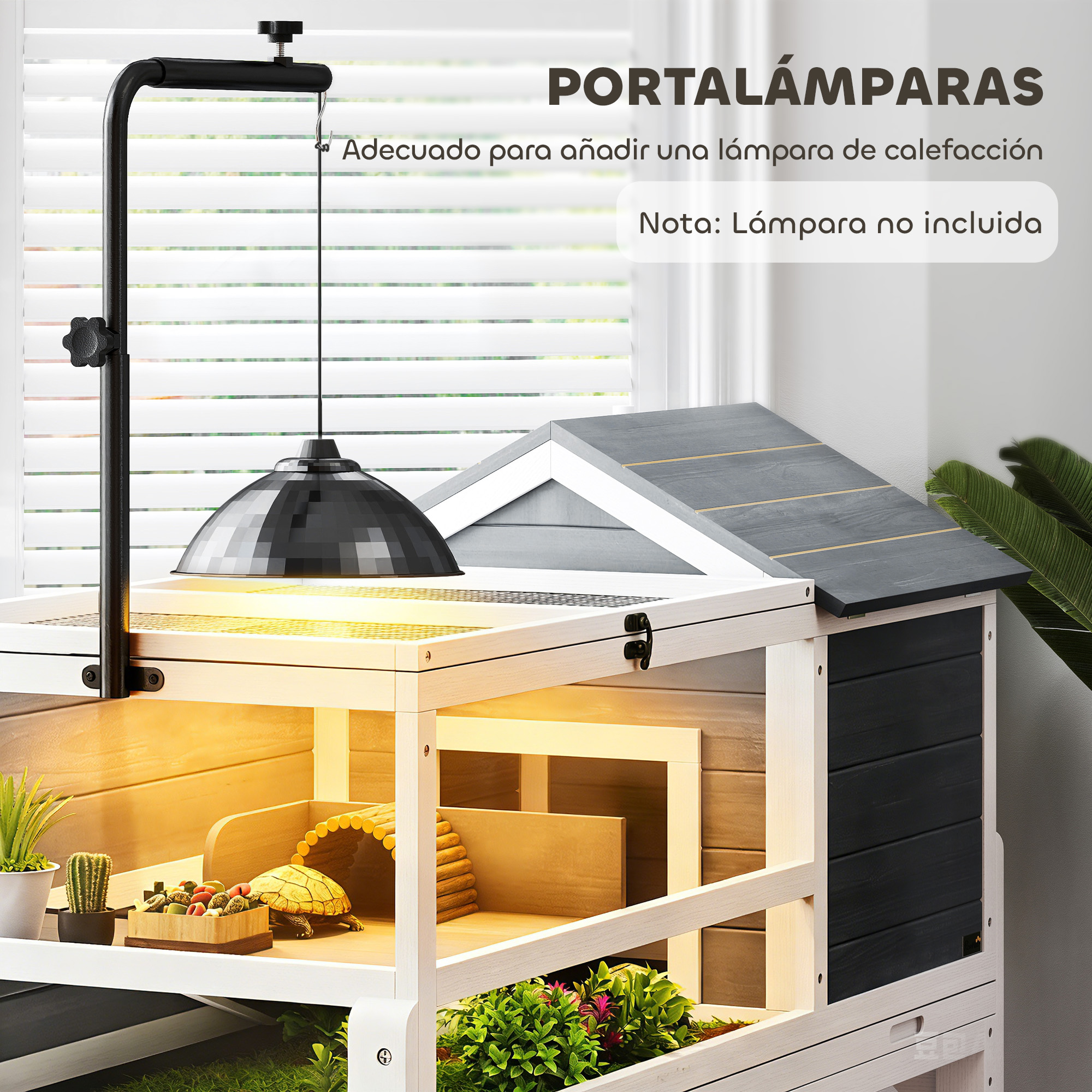 Un hábitat de tortuga con soporte para lámpara, tortuga, comida y plantas.