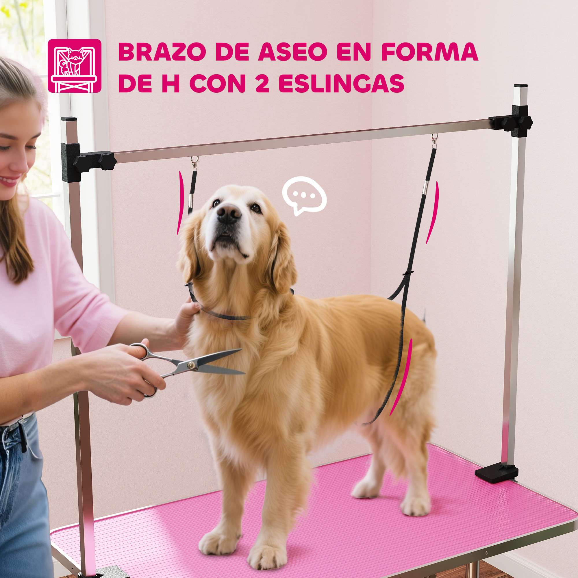 Un golden retriever en una mesa rosa mientras una mujer lo recorta con tijeras.
