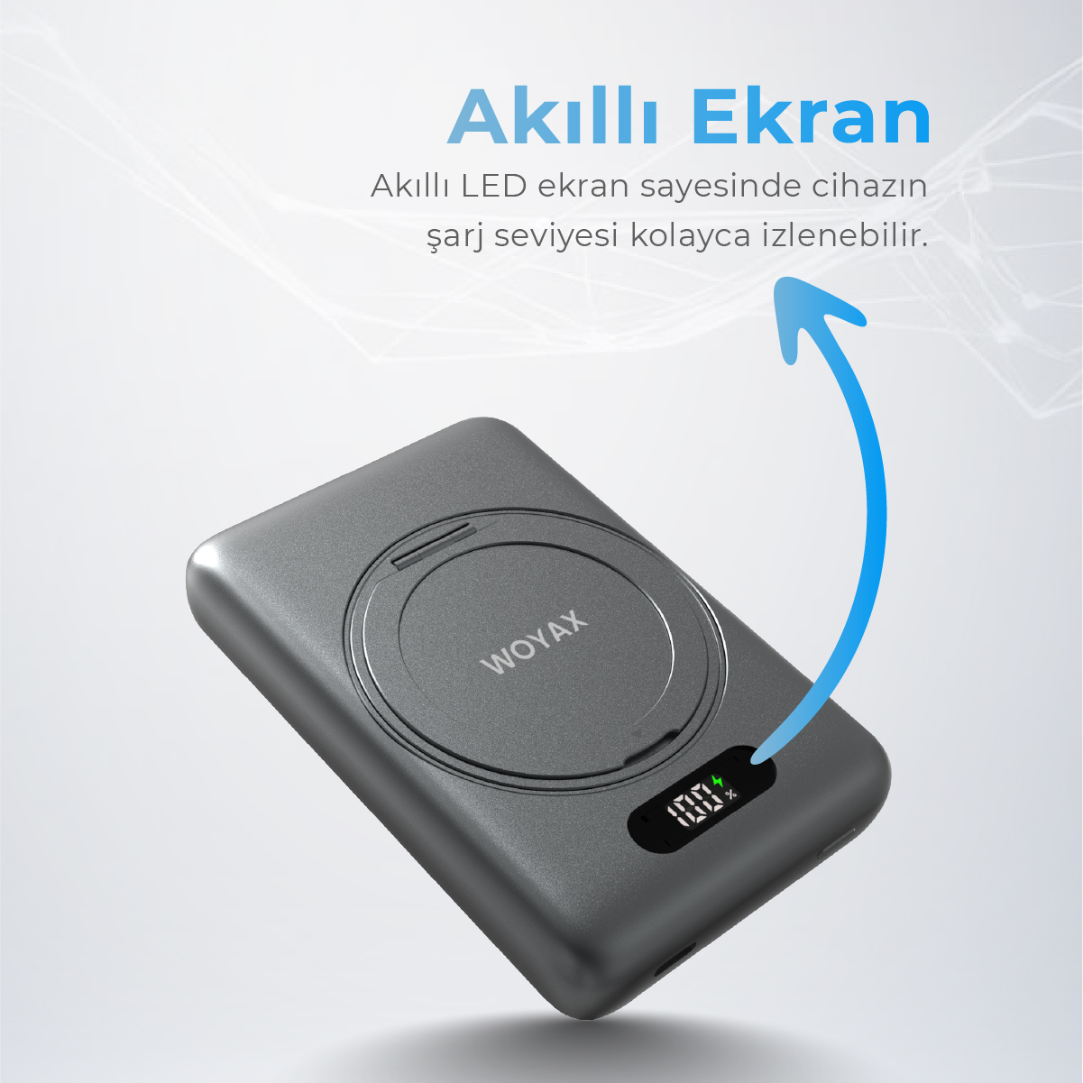 Gri Woyax powerbank, %100 şarj gösteren dijital ekrana sahip.
