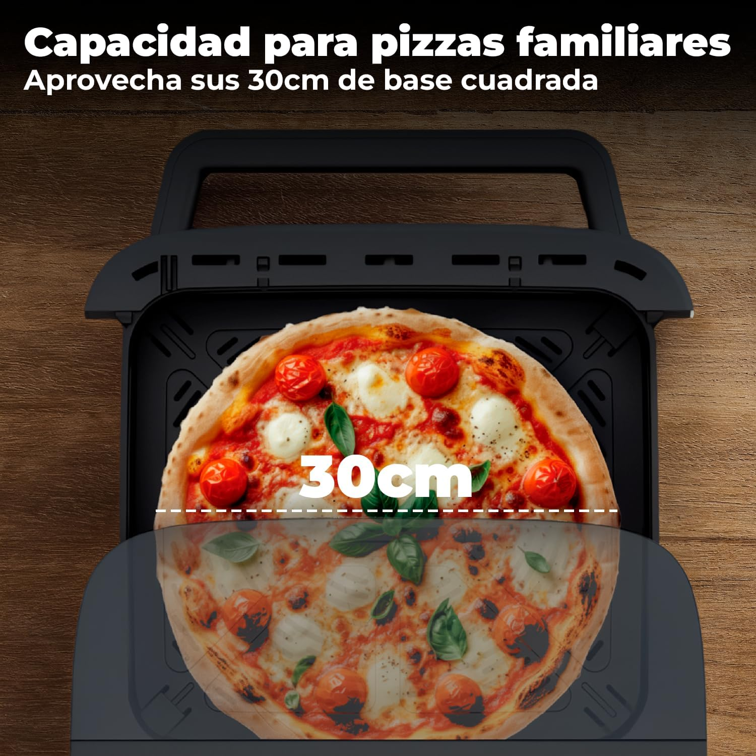 Una pizza rectangular con tomates, mozzarella y albahaca en un aparato negro.