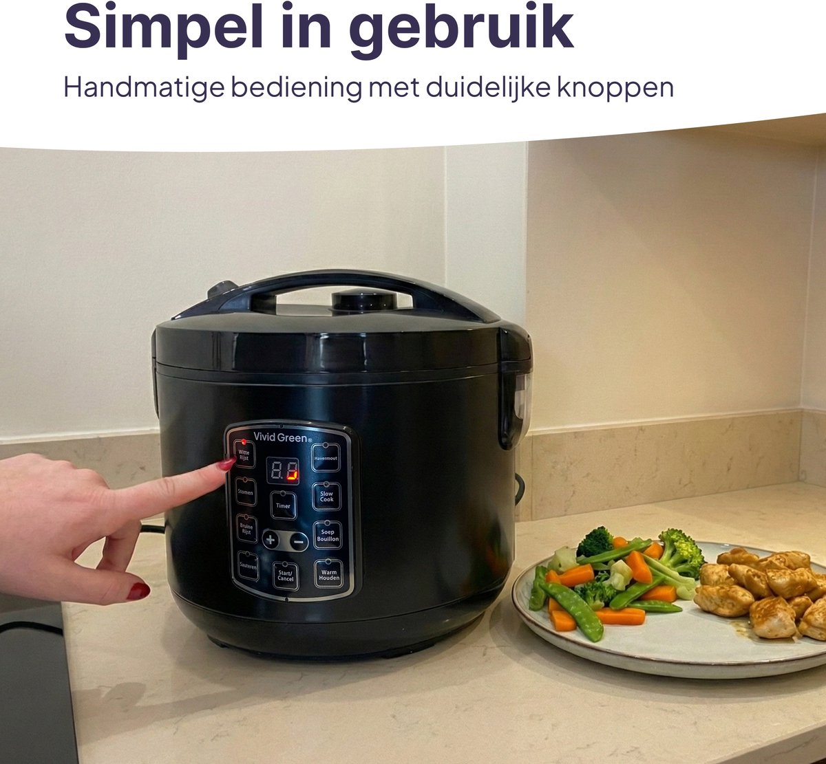 A person operates a black rice cooker. Next to it, a plate with chicken and vegetables.