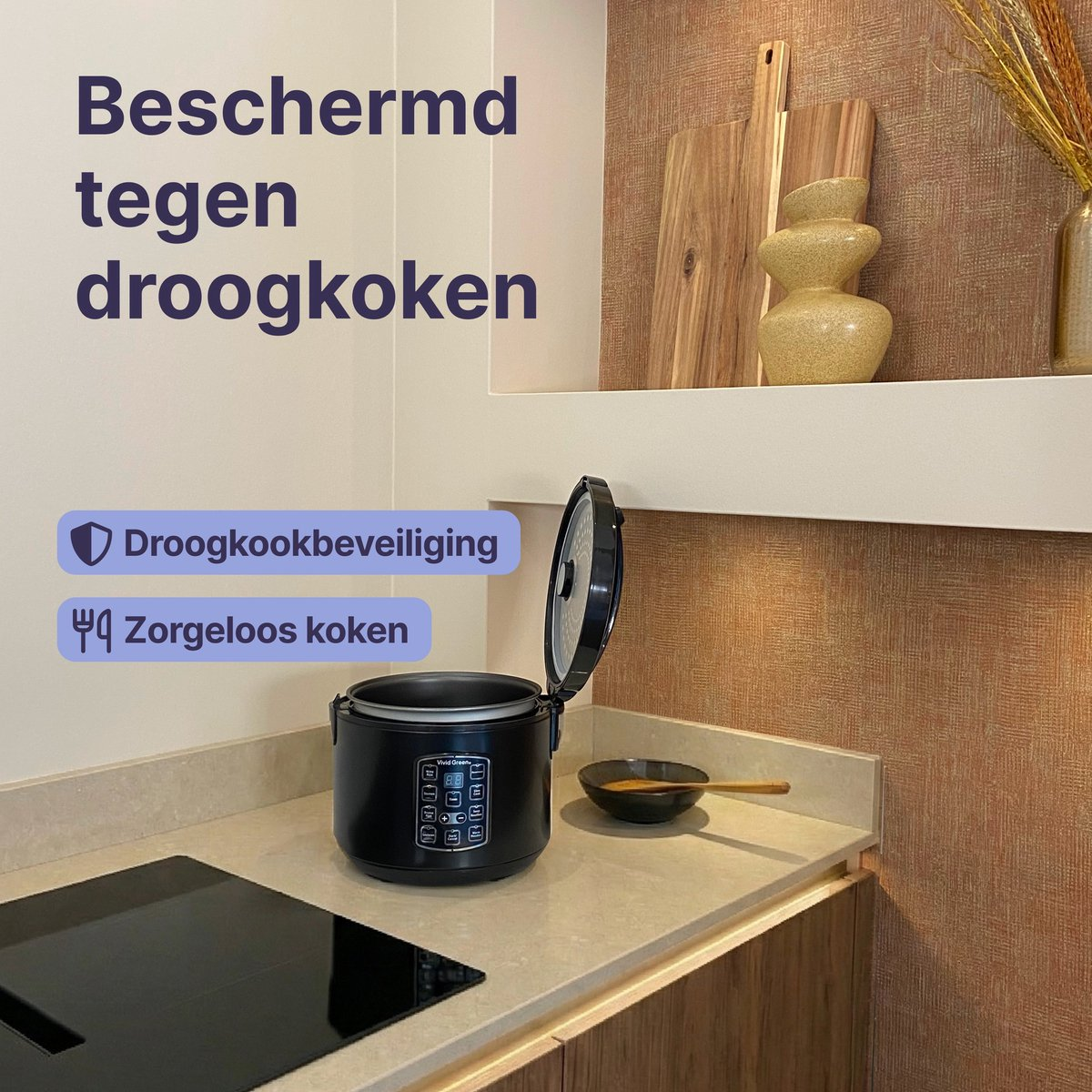 A black rice cooker with an open lid sits on a countertop next to a stove.