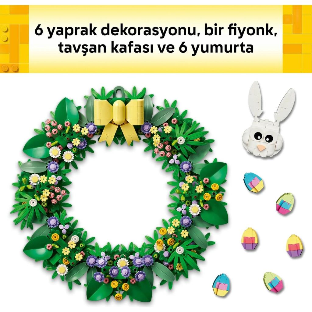 Yeşil yapraklar, çiçekler, sarı fiyonk, tavşan başı ve altı paskalya yumurtasından oluşan çelenk.